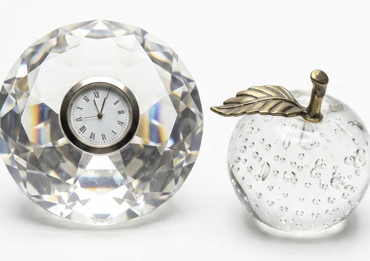 Photo 1 of CLEAR CUT LEAD CRYSTAL FACETED ROUND DESK QUARTZ CLOCK PAPERWEIGHT FEATURES A ROMAN NUMERAL DIAL. & CRYSTAL APPLE PAPERWEIGHT (TALLEST 2.75”)