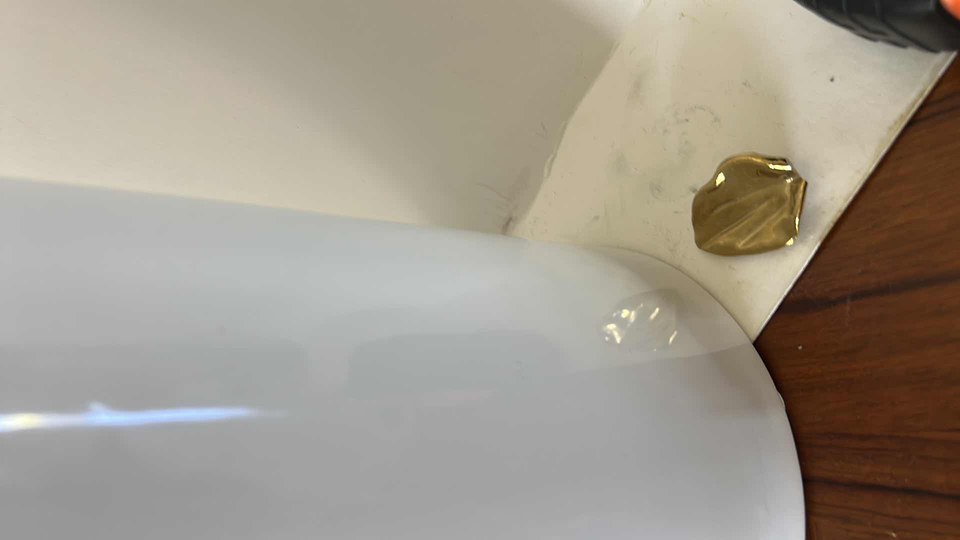 Photo 1 of CERAMIC VASE FEATURES A LARGE, SCULPTURAL GOLD FLOWER DETAIL. H12”