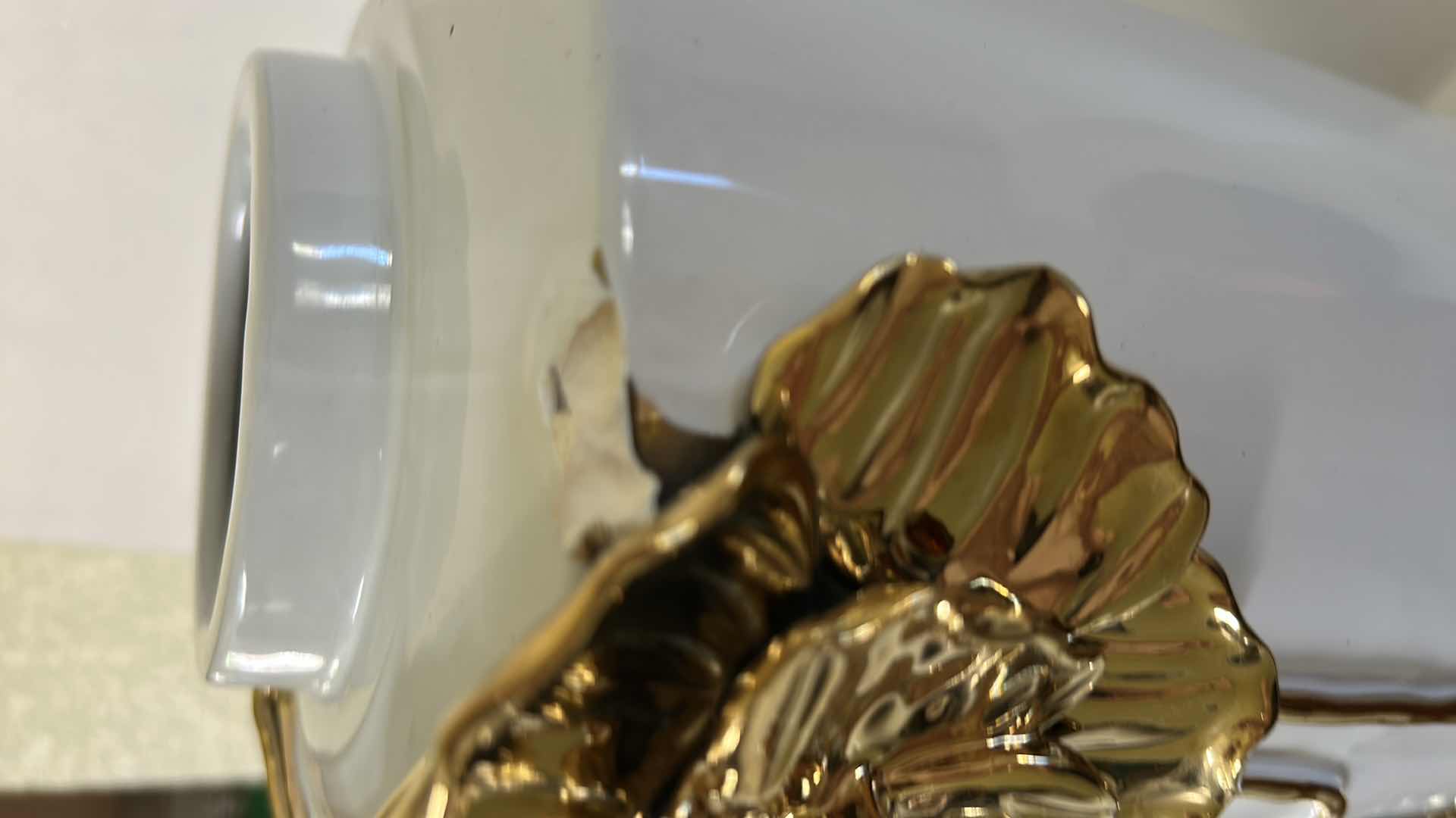 Photo 1 of CERAMIC VASE FEATURES A LARGE, SCULPTURAL GOLD FLOWER DETAIL. H12”