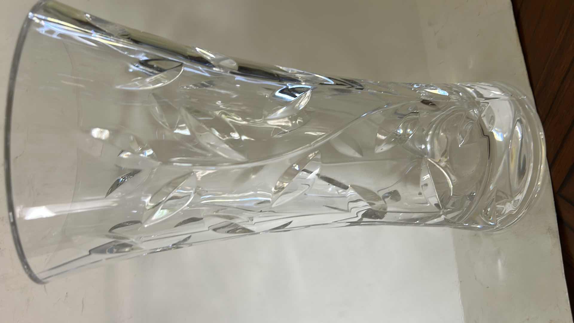 Photo 1 of ROYAL CRYSTAL ROCK LAURUS COLLECTION VASE FEATURES A DISTINCT CUT LEAF AND VINE DESIGN THROUGHOUT THE CLEAR CRYSTAL BODY. H11.75” $60