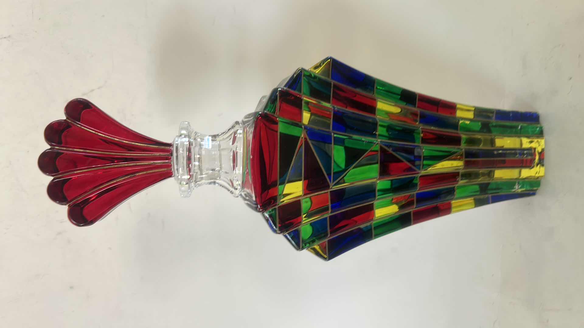 Photo 1 of DECORATIVE ART GLASS DECANTER RESEMBLES THE “SCALENO” DESIGN CREATED BY LUIGI BORMIOLI IN ITALY DURING THE 1970S. THE PIECE FEATURES A VIBRANT GEOMETRIC MOSAIC PATTERN AND A DISTINCTIVE FAN-SHAPED STOPPER H12”