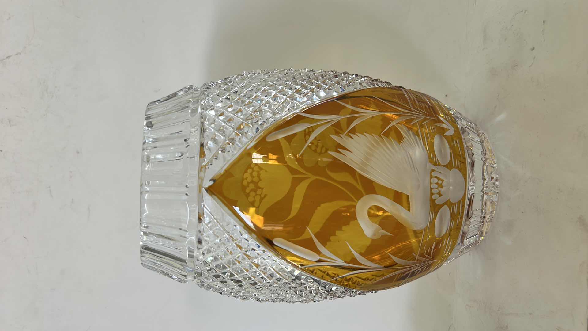 Photo 1 of JULIA POLAND LEAD CRYSTAL VASE, FEATURING A DISTINCTIVE AMBER-TO-CLEAR CUT DESIGN WITH A SWAN MOTIF. H8”