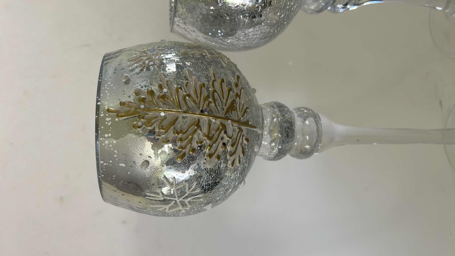 Photo 1 of 2 SNOWFLAKE CANDLE HOLDERS, GLASS WITH SILVER CRACKLE ( TALLEST H14”)