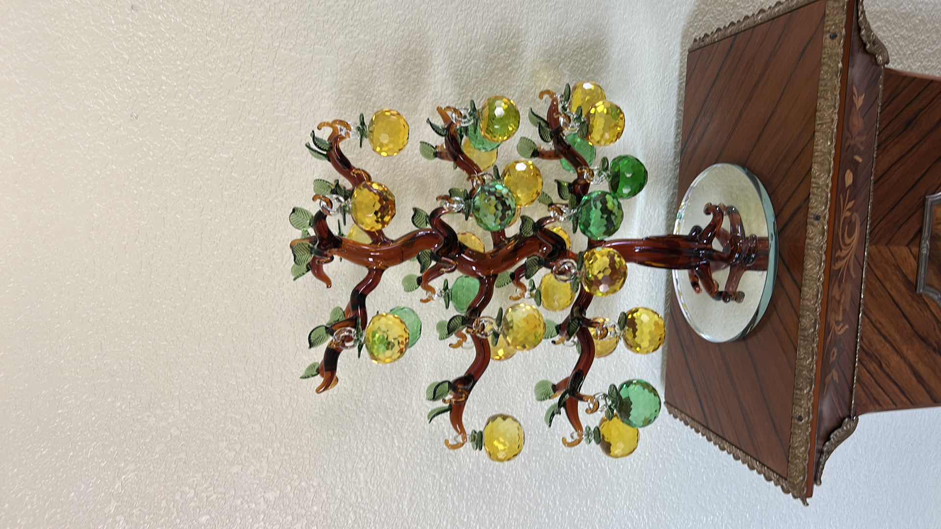 Photo 1 of YU FENG BRAND ARTIFICIAL CRYSTAL APPLE TREE FEATURES GOLDEN AND GREEN FACETED GLASS FRUITS HANGING FROM A SCULPTED BROWN GLASS TRUNK. H17”