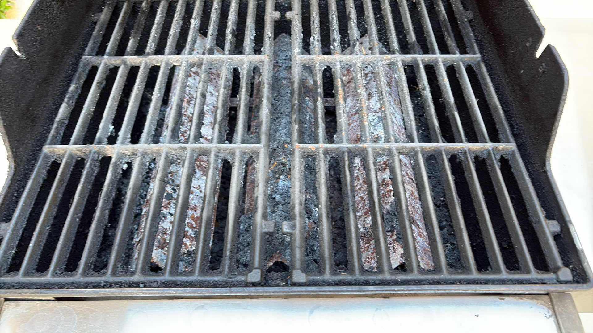 Photo 1 of WEBER SPIRIT 2-BURNER PROPANE GAS GRILL WITH SIDE SHELVES, ENCLOSED STORAGE CABINET, BUILT-IN LID THERMOMETER, AND ROLLING CART W COVER 50”X21”H45”