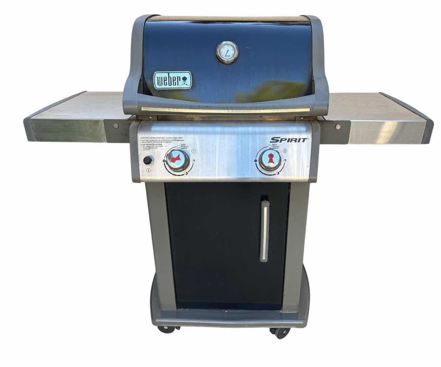 Photo 1 of WEBER SPIRIT 2-BURNER PROPANE GAS GRILL WITH SIDE SHELVES, ENCLOSED STORAGE CABINET, BUILT-IN LID THERMOMETER, AND ROLLING CART W COVER 50”X21”H45”