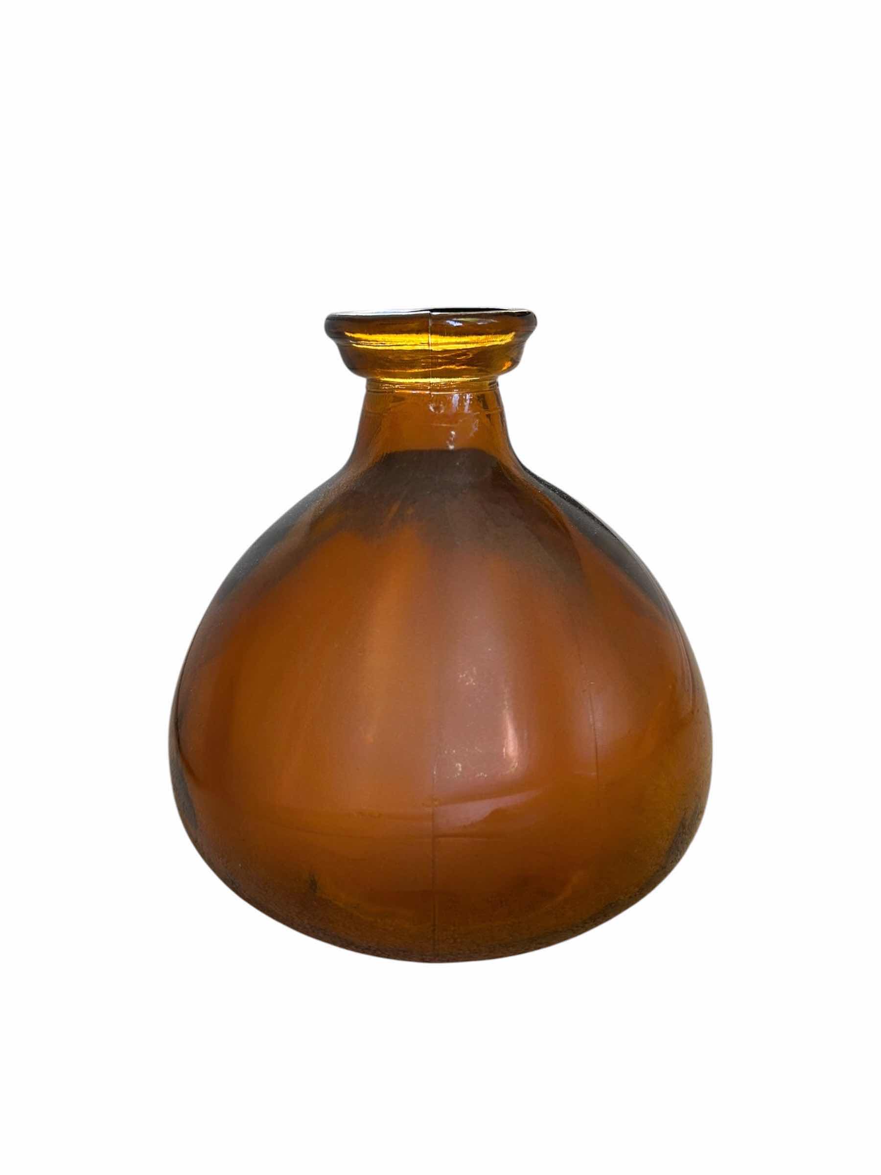 Photo 1 of AMBER GLASS SHORT WIDE VASE ($65)