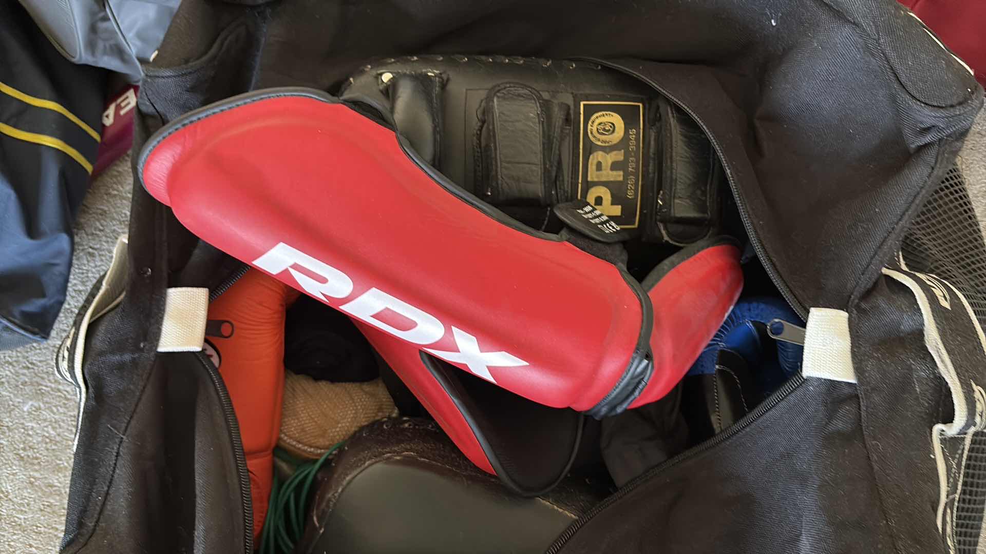 Photo 1 of ASSORTED BOXING AND MUAY THAI TRAINING GEAR INCLUDING BOXING GLOVES, FOCUS MITTS, THAI KICK PADS