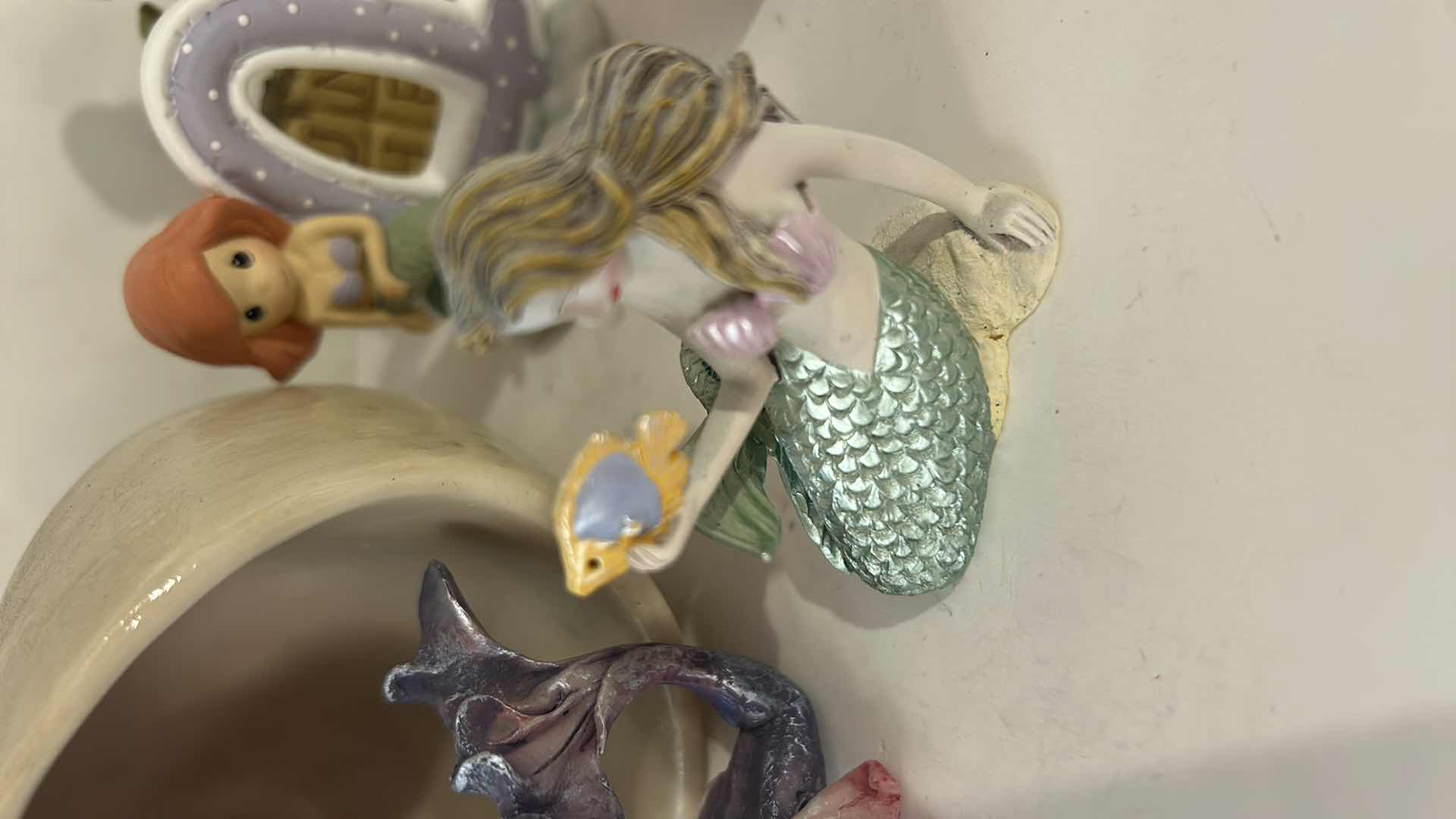 Photo 1 of 10 - SMALL MERMAID FIGURINES AND ONE SHELL.