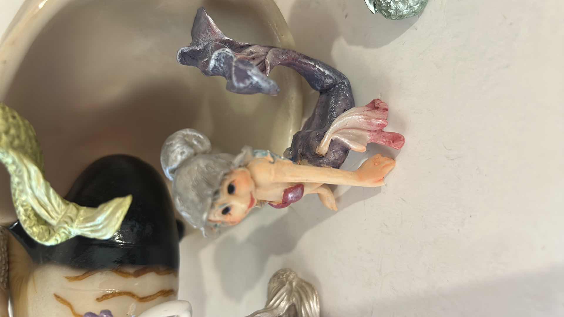 Photo 1 of 10 - SMALL MERMAID FIGURINES AND ONE SHELL.