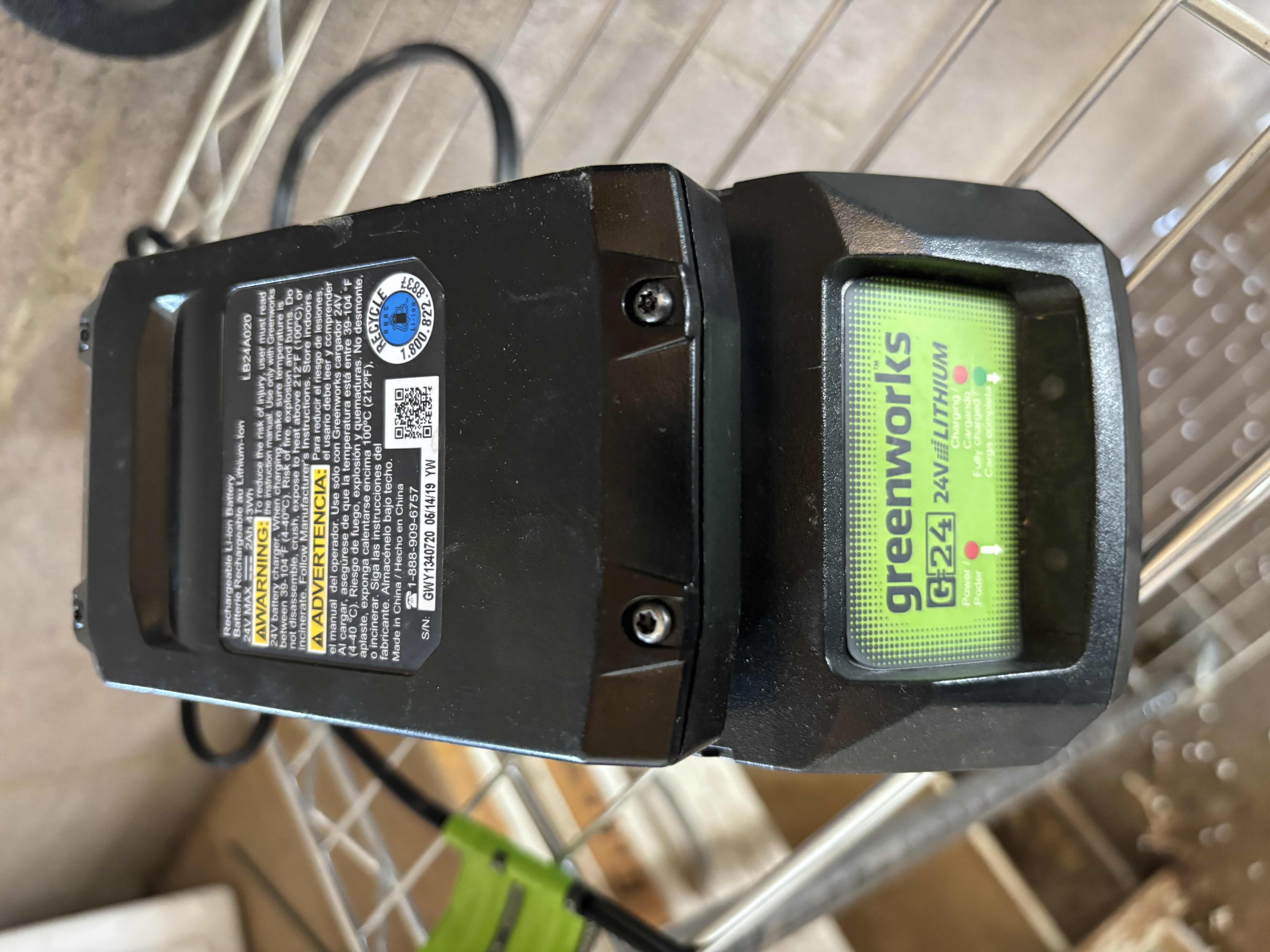 Photo 1 of GREENWORKS CHAINSAW WITH BATTERY AND CHARGER