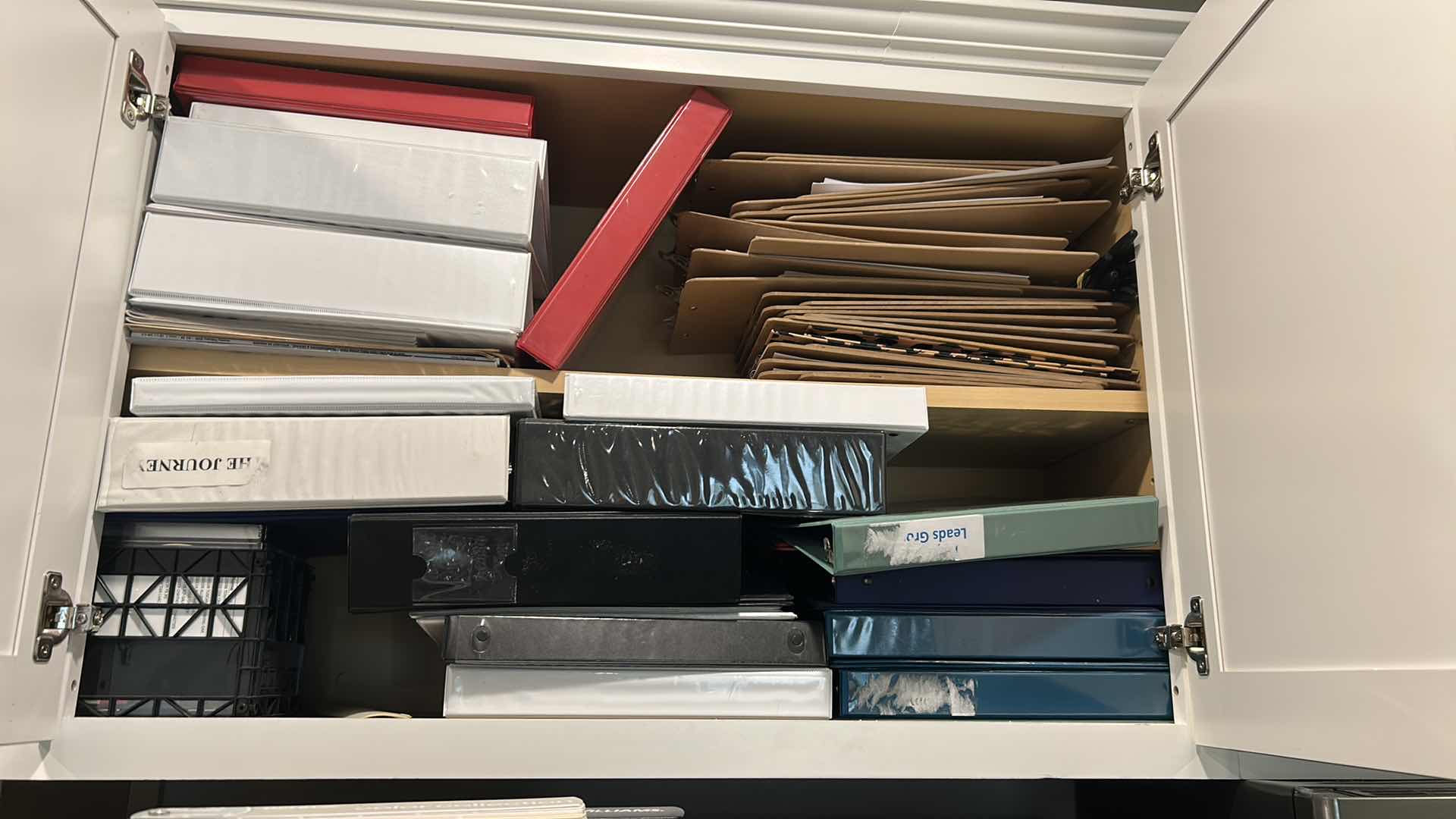 Photo 1 of CONTENTS OF CABINET ASSORTED BINDERS