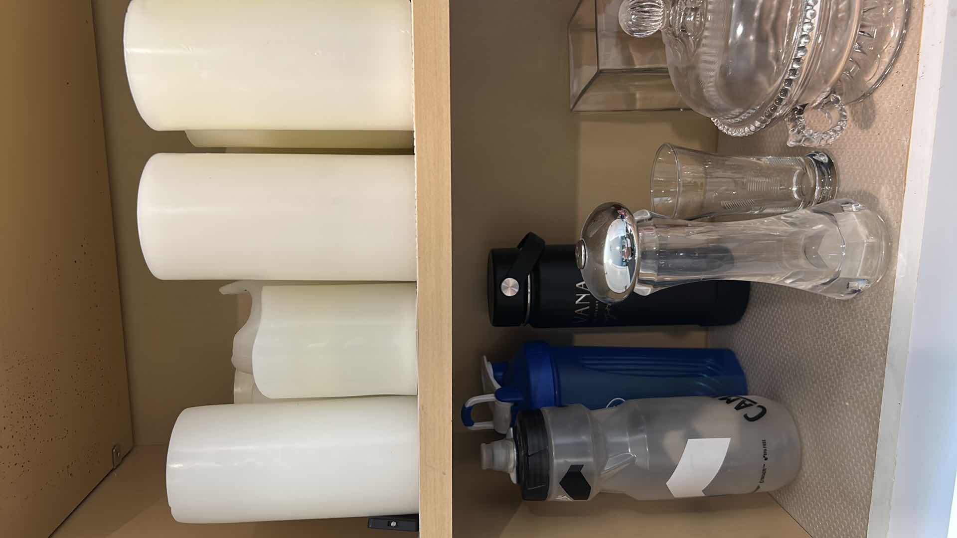 Photo 1 of CONTENTS OF CABINET CANDLES KITCHEN WARE