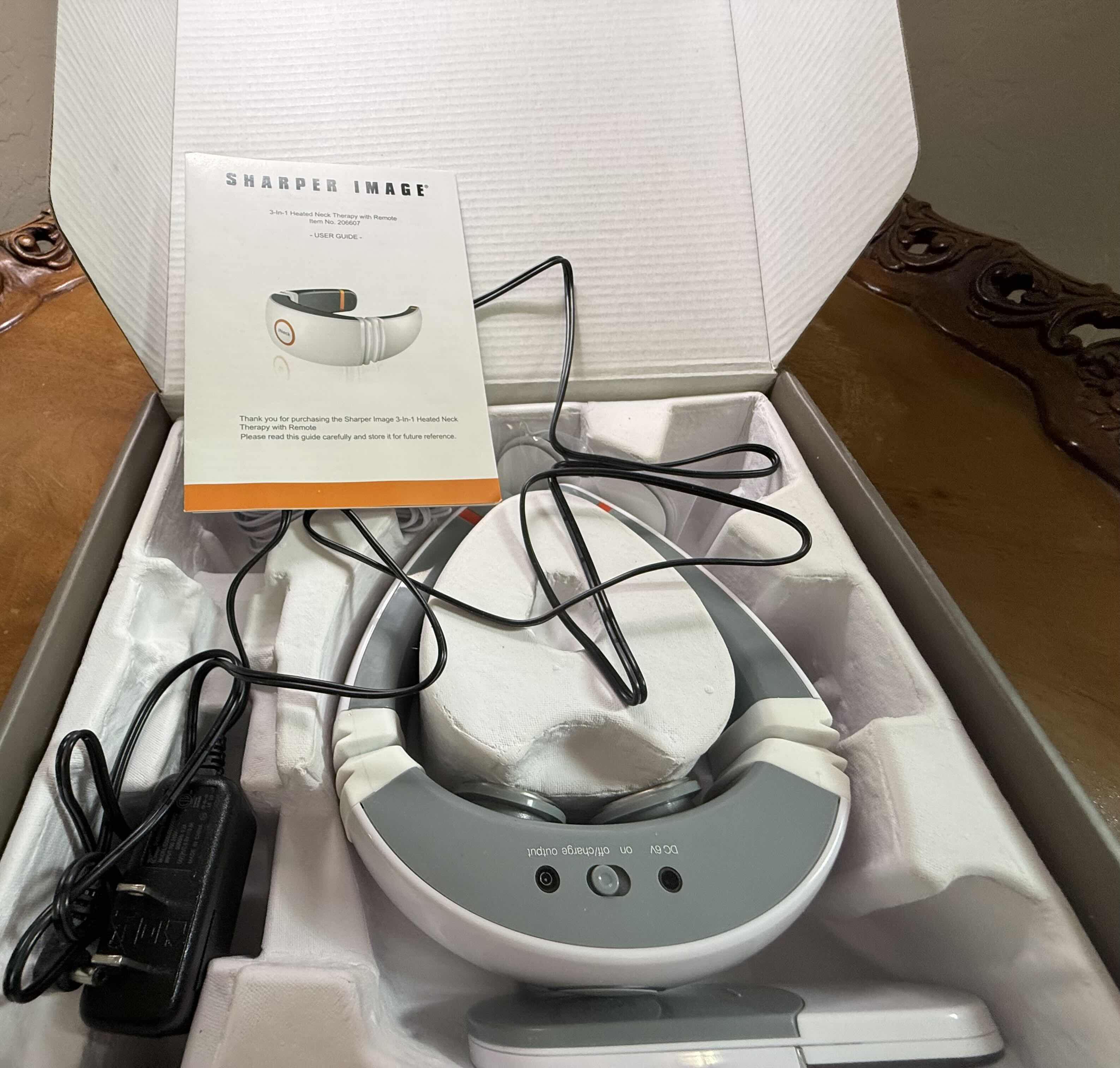 Photo 1 of NIB SHARPER IMAGE 3-IN-1 NECK THERAPY W REMOTE