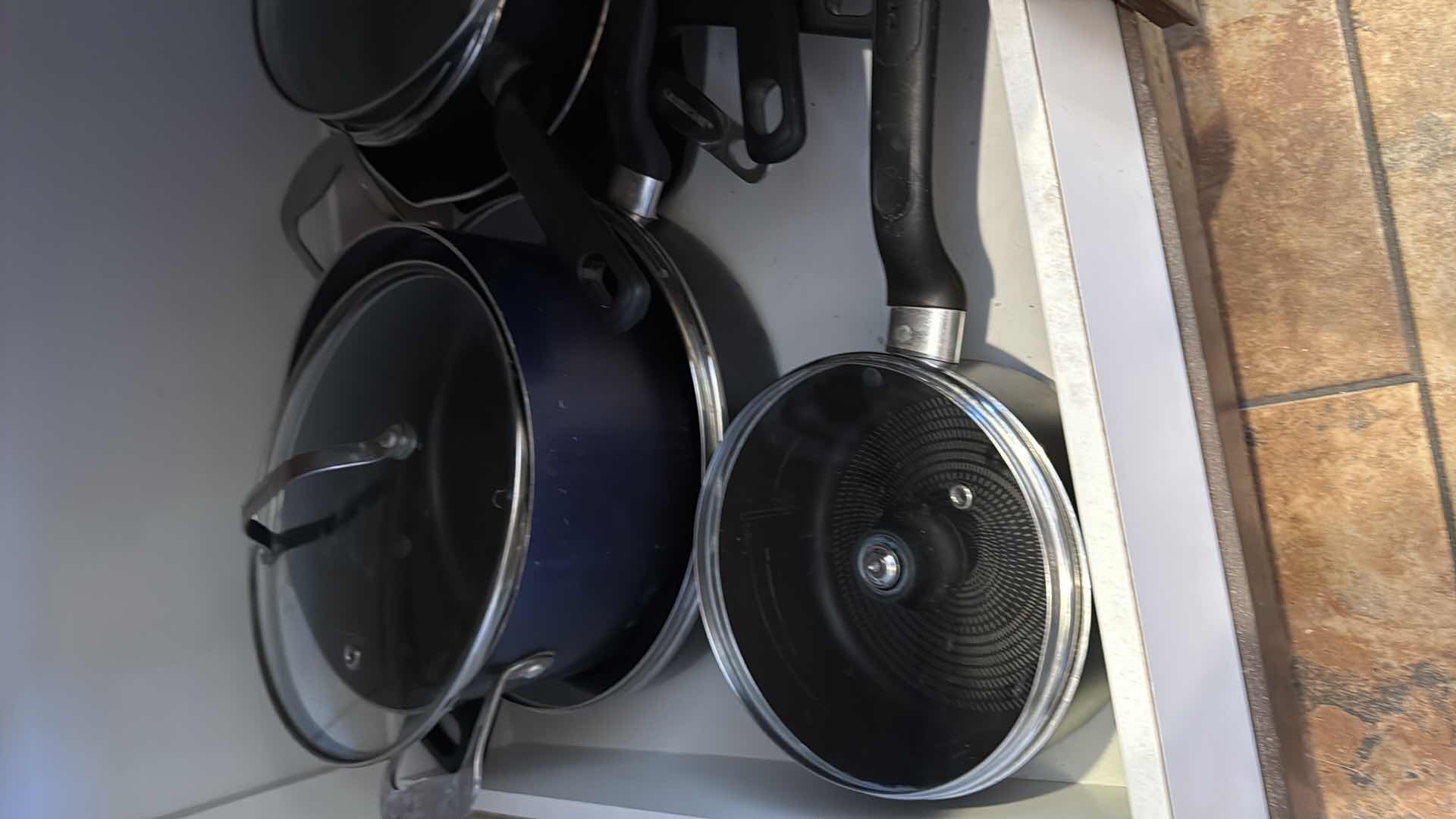 Photo 1 of CONTENTS OF KITCHEN CABINET-POTS & PANS