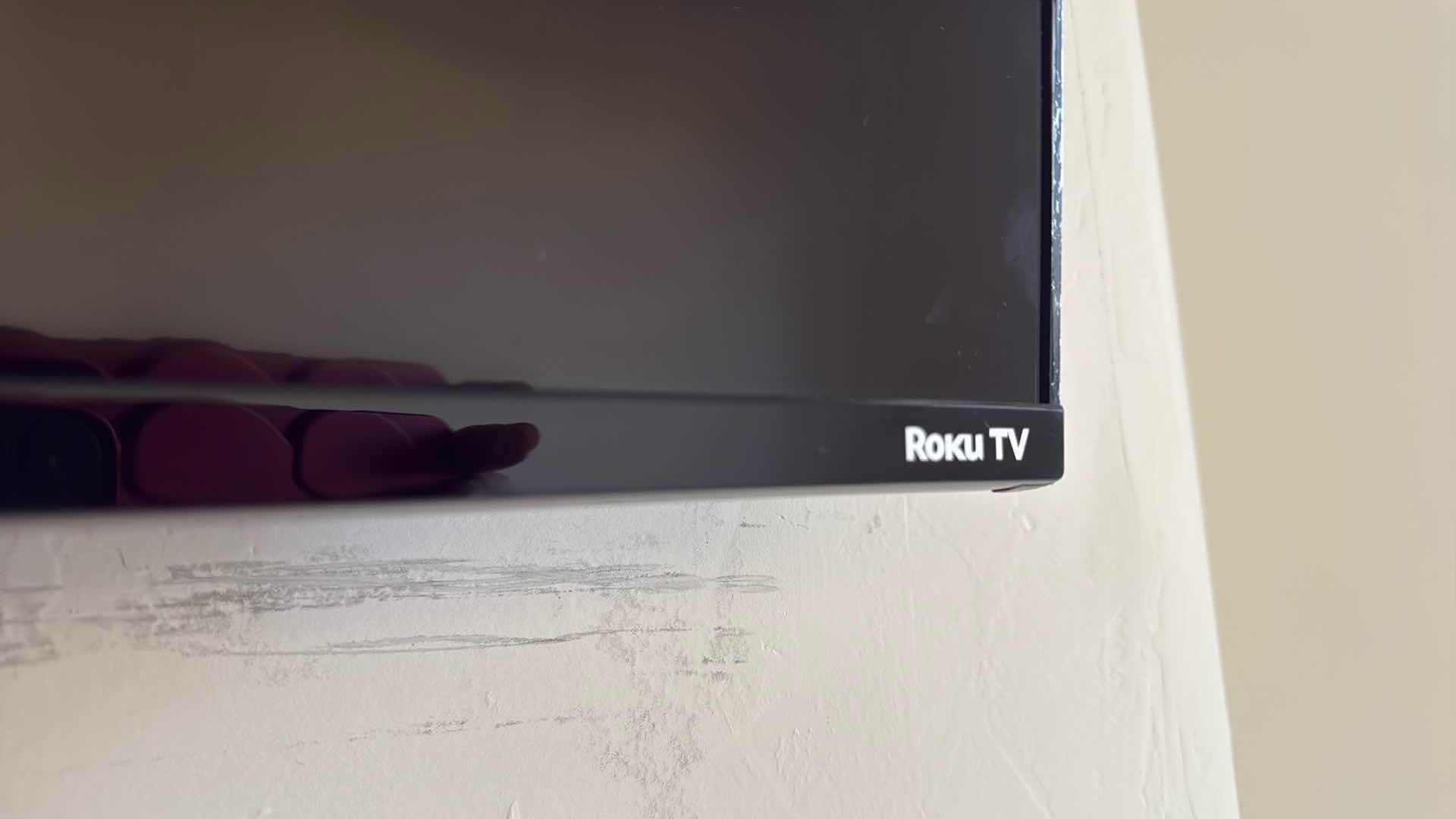 Photo 1 of 75” ROKU FLATSCREEN TV W WALL BRACKET & REMOTE