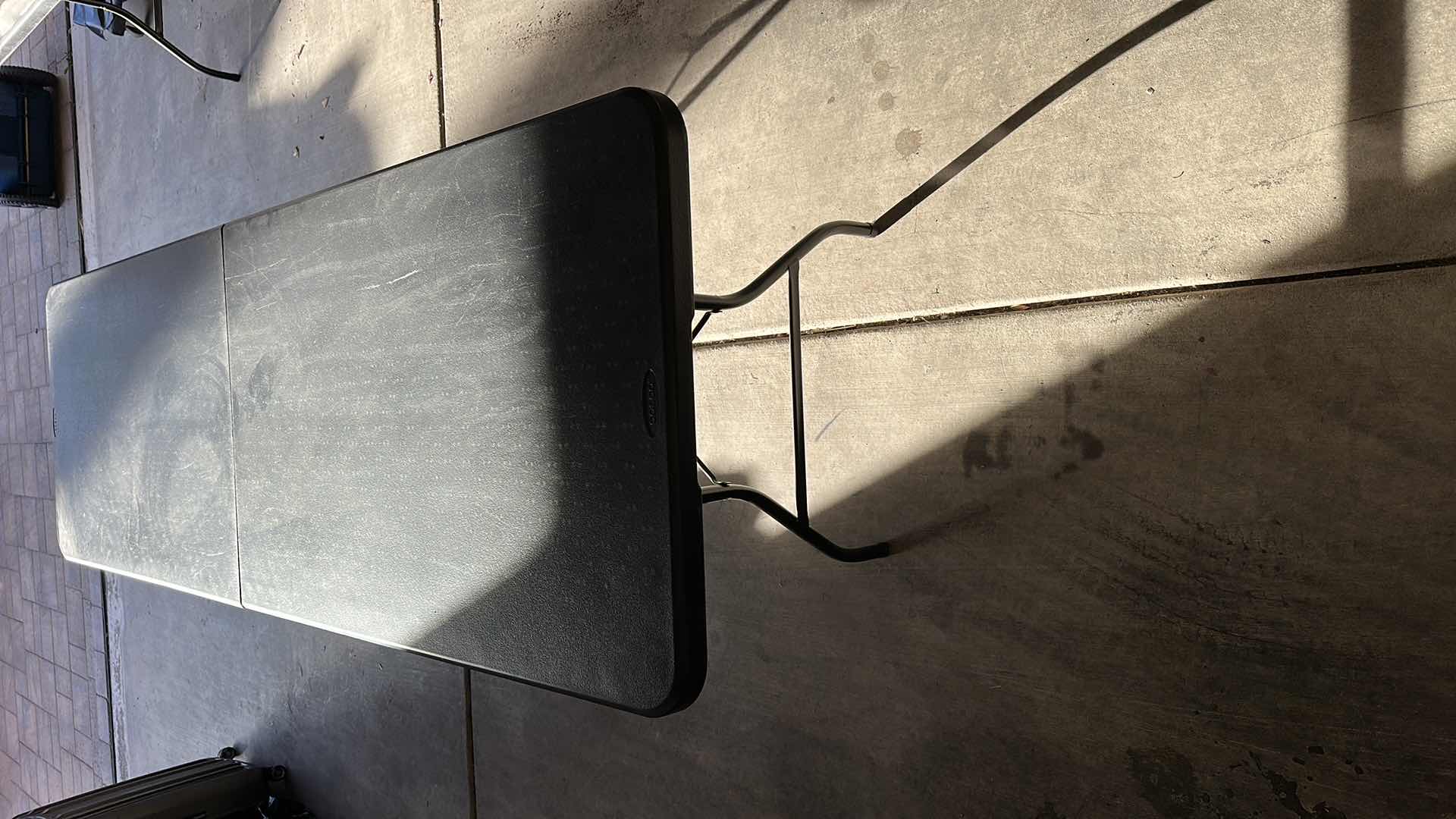 Photo 1 of 8' BLACK COSCO UTILITY FOLDING TABLE