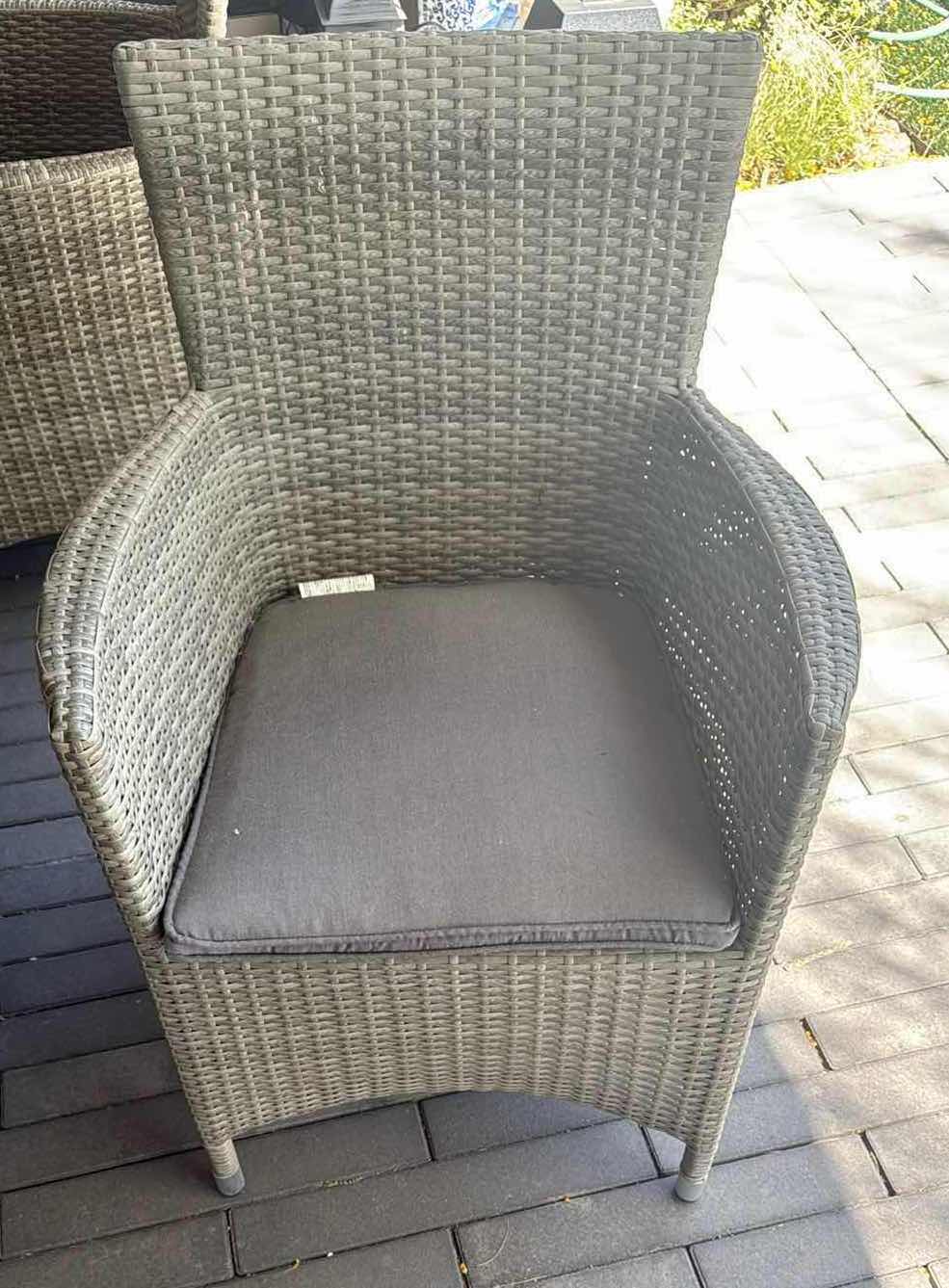 Photo 1 of WICKER PATIO LIGHT GRAY TABLE W GLASS TOP PROTECTOR & 6 ARM CHAIRS 79” x 40” H29” (SEE NOTES)