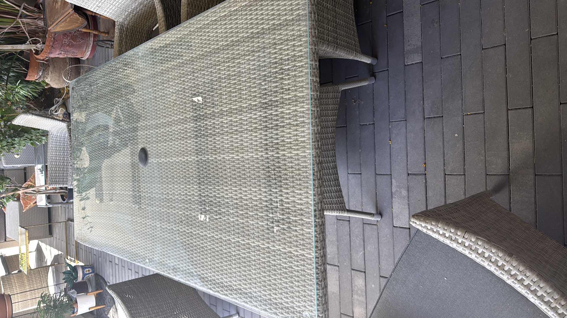 Photo 1 of WICKER PATIO LIGHT GRAY TABLE W GLASS TOP PROTECTOR & 6 ARM CHAIRS 79” x 40” H29” (SEE NOTES)