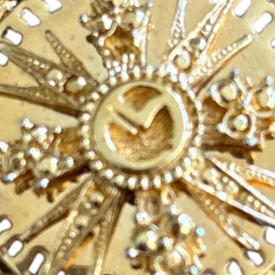 Photo 1 of VINTAGE ST.JOHN GOLD TONE ROUND BROOCH IN STARBURST DESIGN W BRAIDED ROPE BORDER H2”