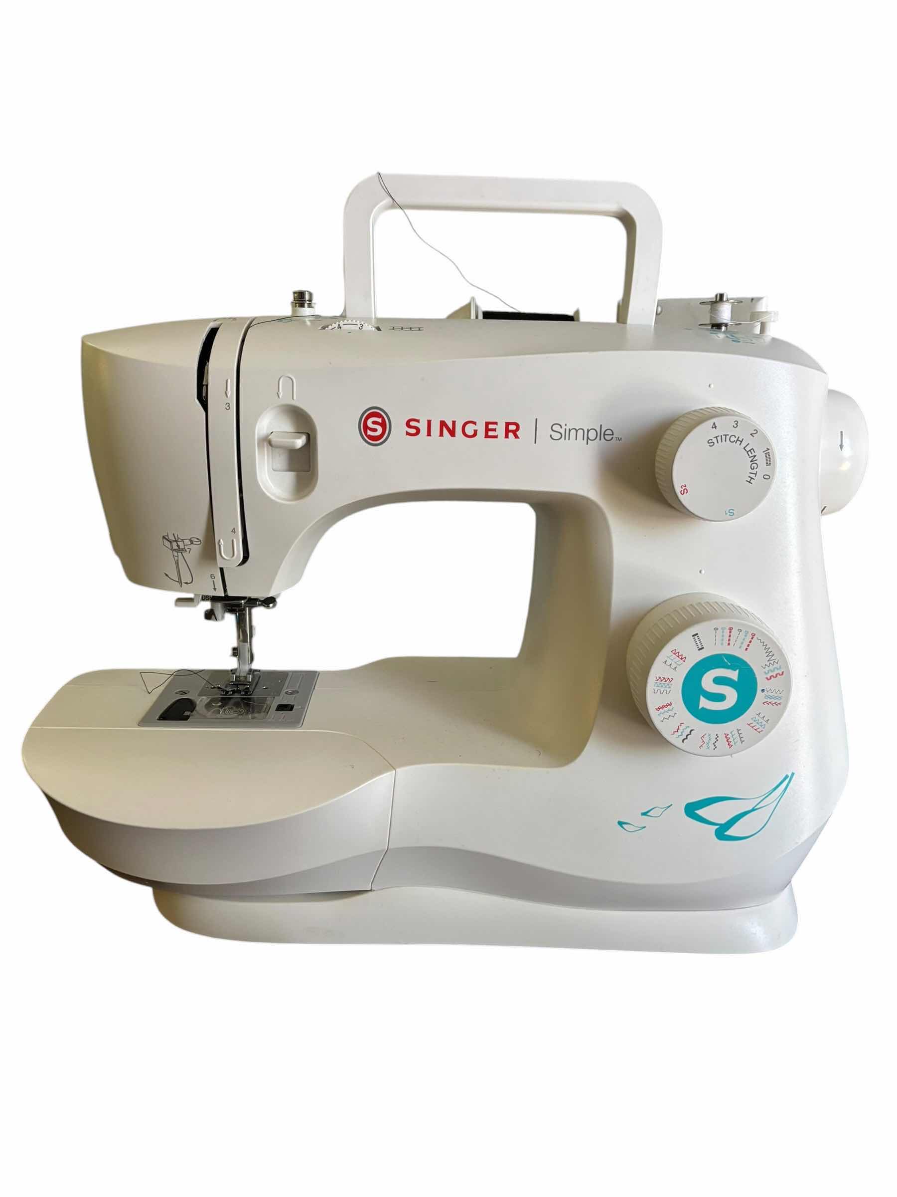 Photo 1 of SINGER SEWING MACHINE