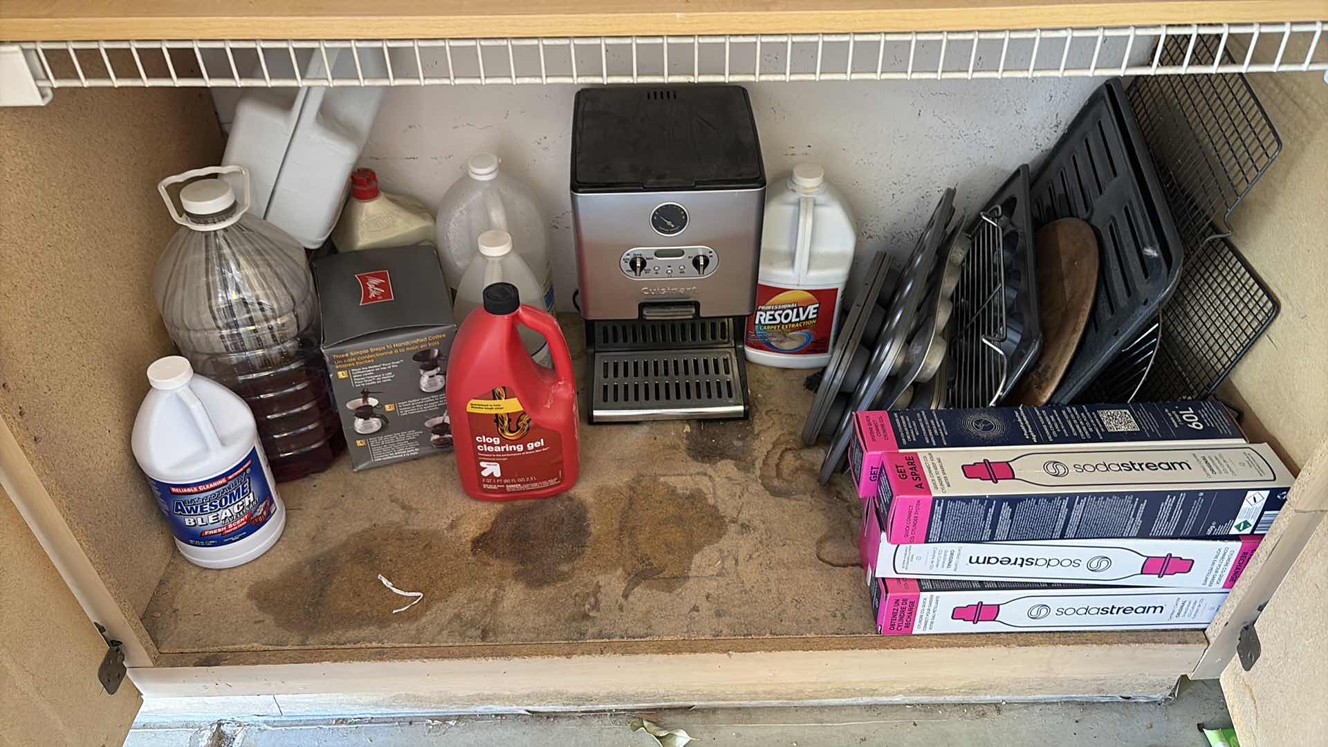 Photo 1 of SHELVES OF CLEANING SUPPLIES , PLASTIC CUTLERY AND BAKING DISHES