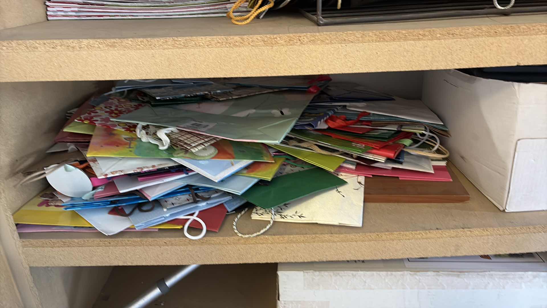 Photo 1 of CONTENTS OF GARAGE-GIFT BAGS, T SHIRT BOXES, CERAMIC DECOR