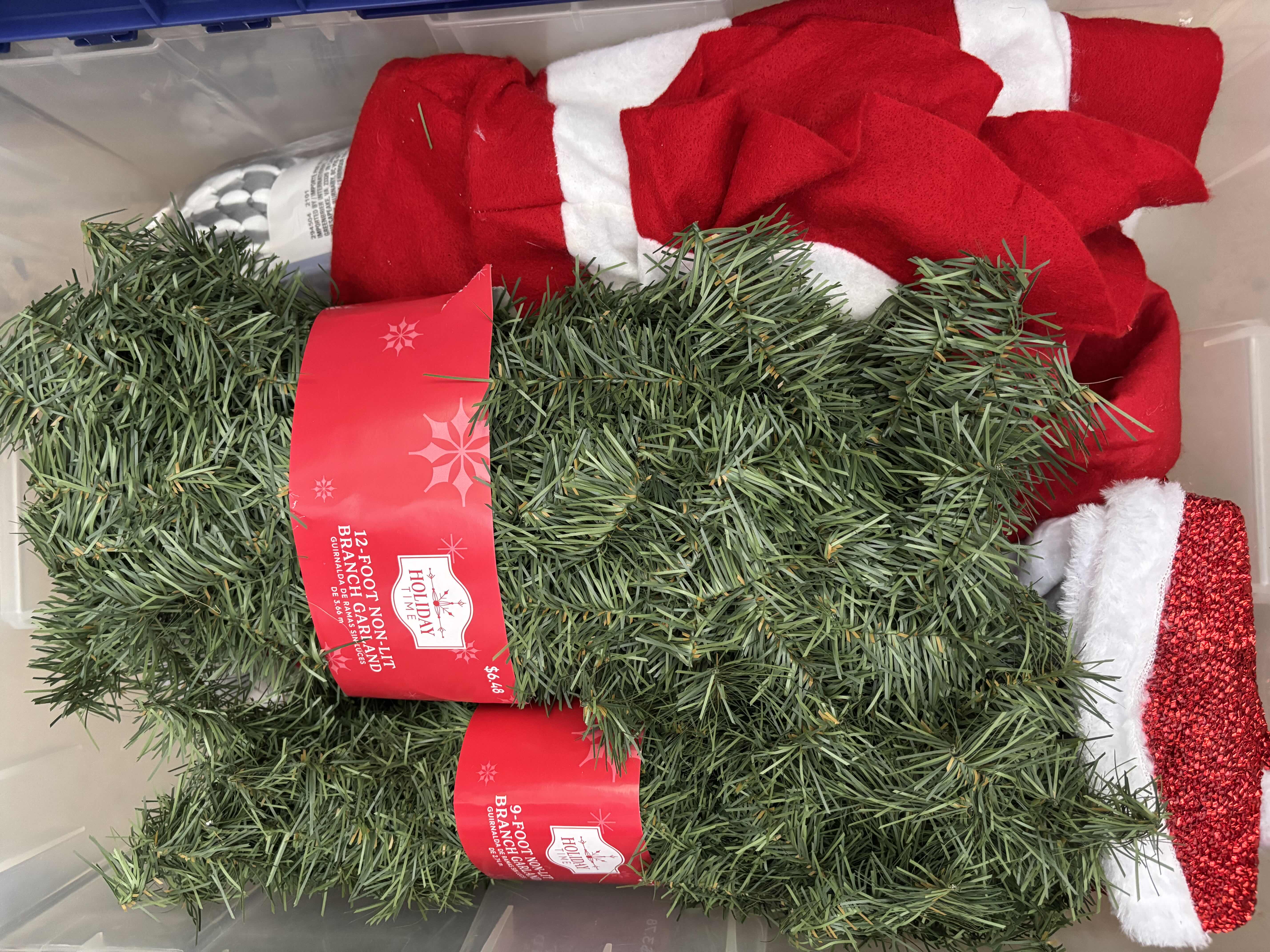 Photo 1 of CONTAINERS (2) OF CHRISTMAS DECOR, BOX OF CHRISTMAS TINS & YARD SIGNS