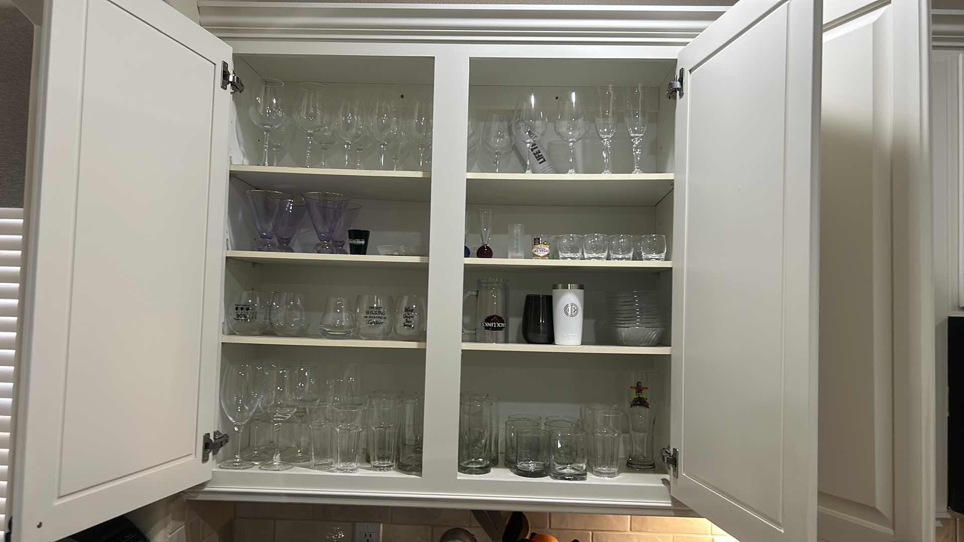Photo 1 of CONTENTS OF KITCHEN CABINET , GLASSWARE, STEMWARE, AND MORE