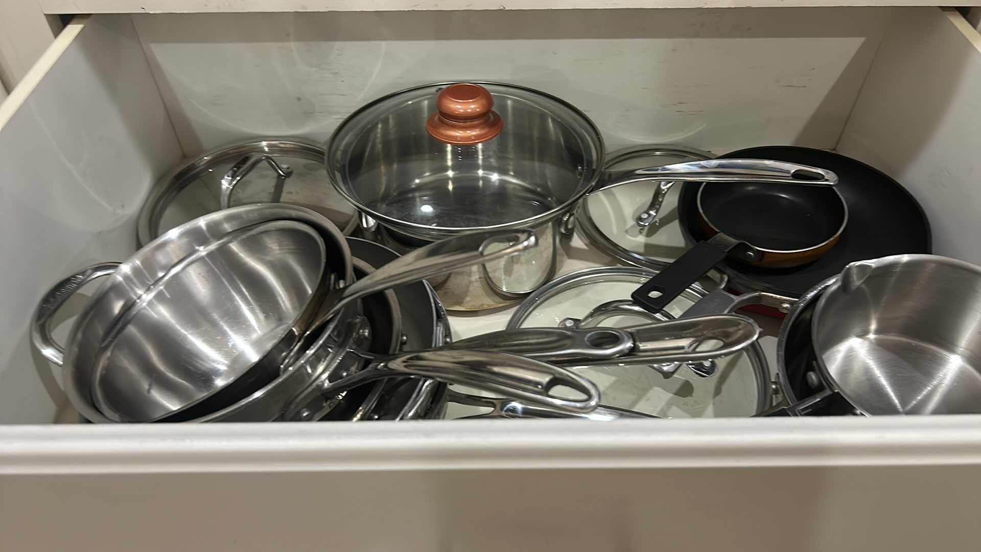 Photo 1 of DRAWER, FULL OF CUISINART POTS AND PANS WITH LIDS