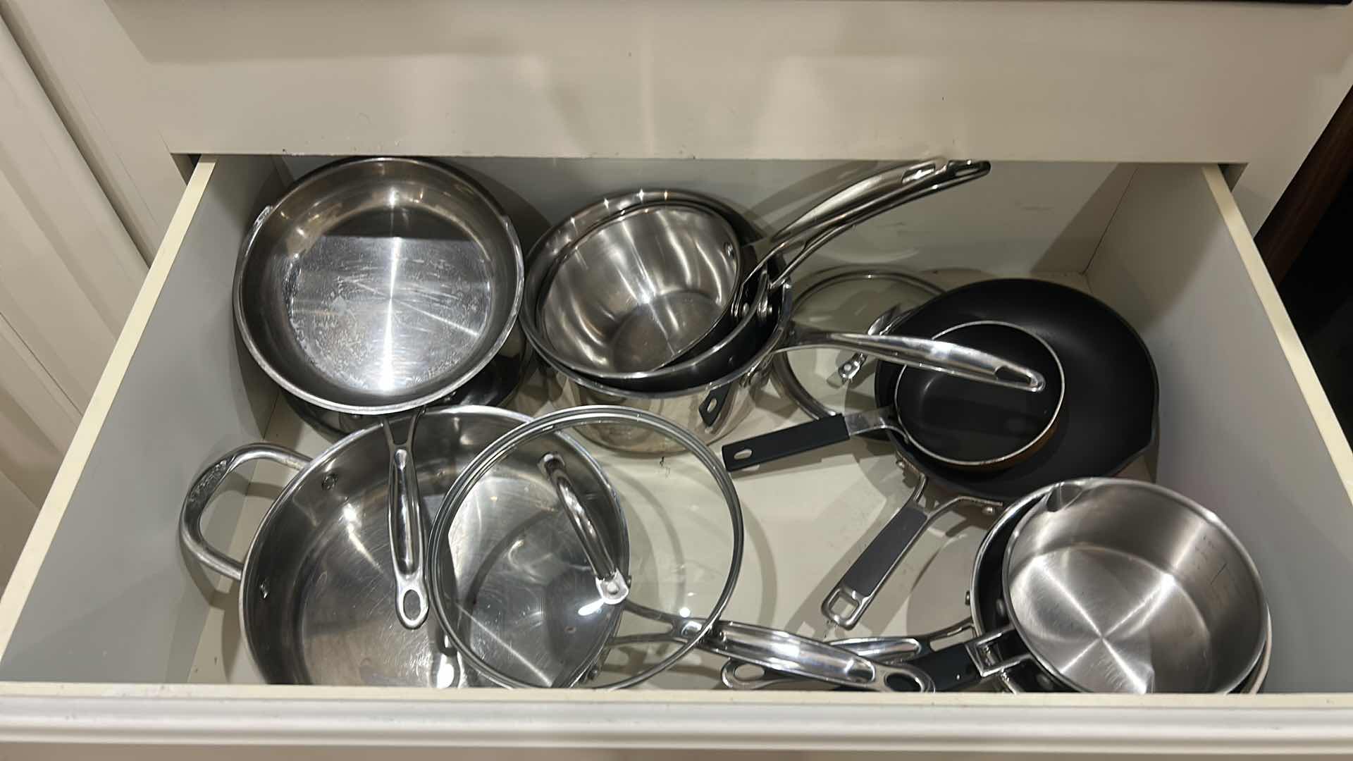 Photo 1 of DRAWER, FULL OF CUISINART POTS AND PANS WITH LIDS