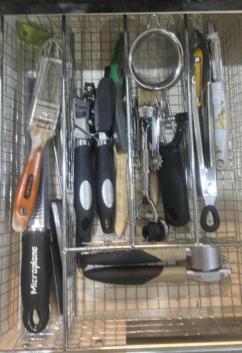 Photo 1 of CONTENTS OF DRAWER IN KITCHEN CAN OPENER BOTTLE OPENERS CHEESE, GRATER, AND