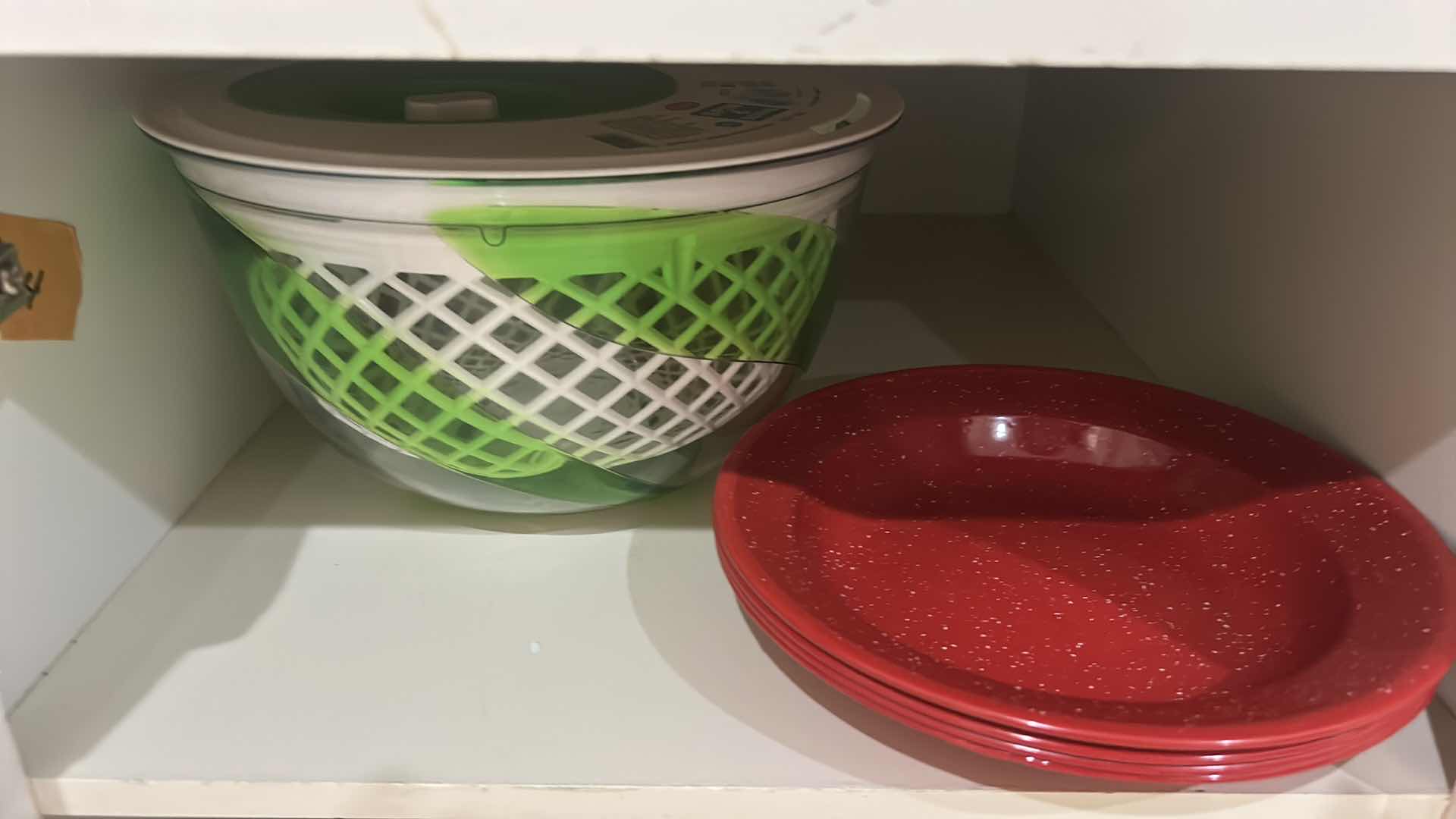 Photo 1 of CONTENTS OF CABINET IN KITCHEN PLATES, SALAD, SPINNER, COLANDERS, AND MORE