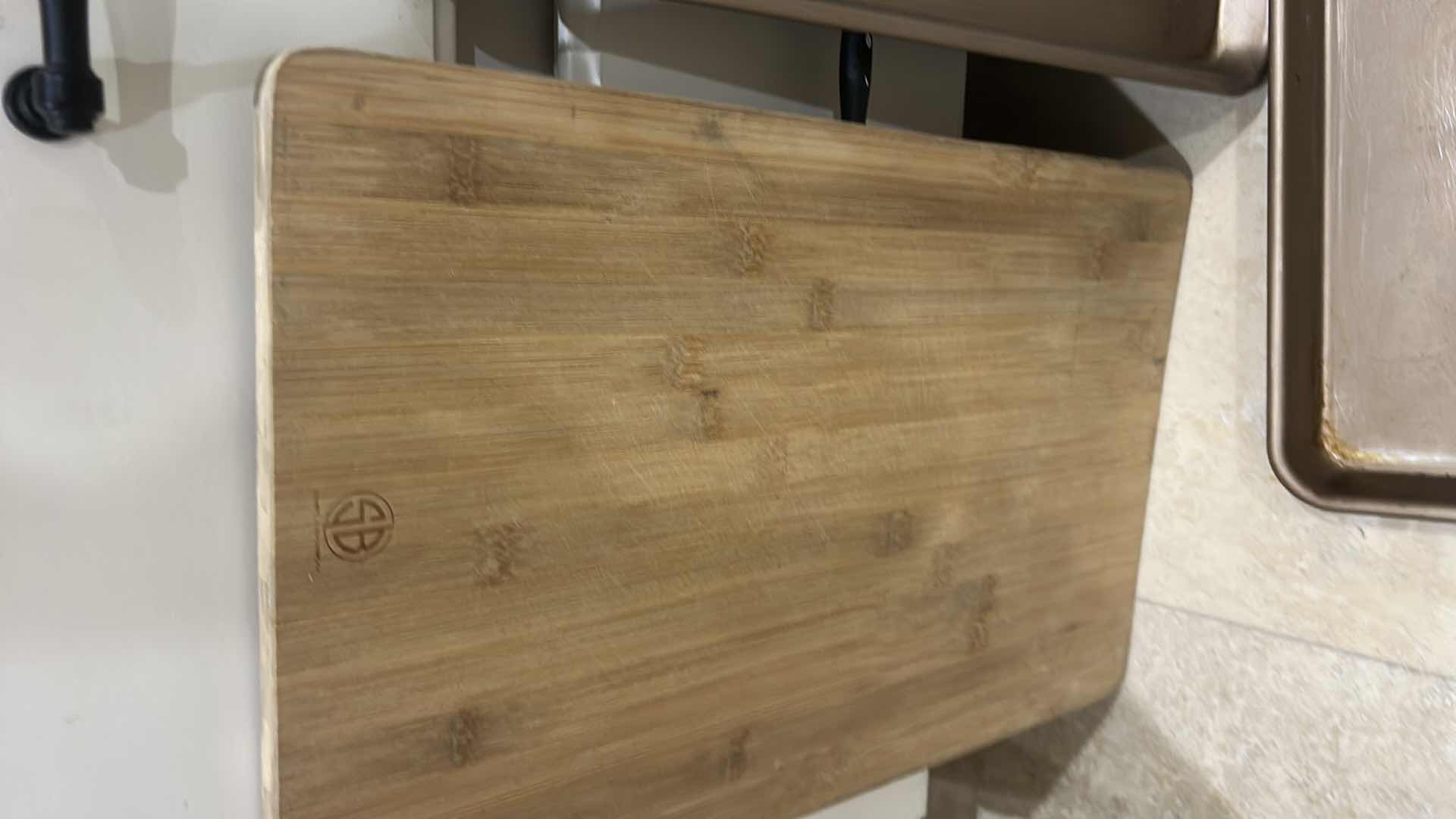 Photo 1 of CONTENTS OF CABINET IN KITCHEN, CUTTING BOARDS BAKING TRAYS