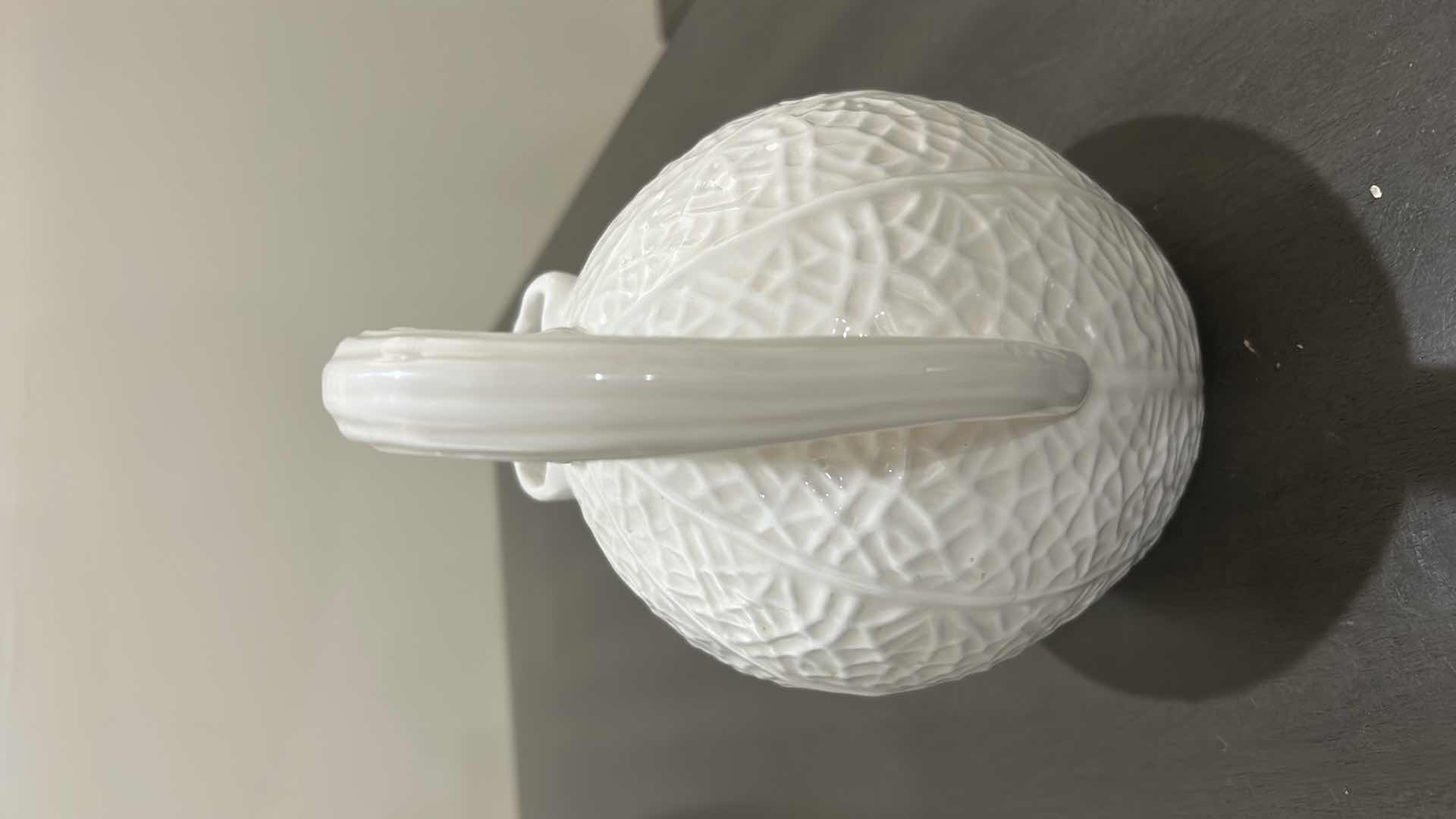 Photo 1 of BLOOMINGDALES WHITE CERAMIC PITCHER IS DESIGNED WITH A UNIQUE TEXTURED REPTILIAN PATTERN REMINISCENT OF A KAISER REPTILE PATTERN VASE.