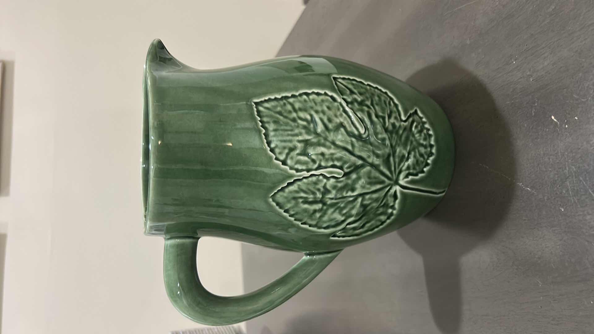 Photo 1 of GREEN CERAMIC PITCHER IS A BORDALLO PINHEIRO MAJOLICA PIECE FROM PORTUGAL FEATURING AN EMBOSSED MAPLE LEAF DESIGN.