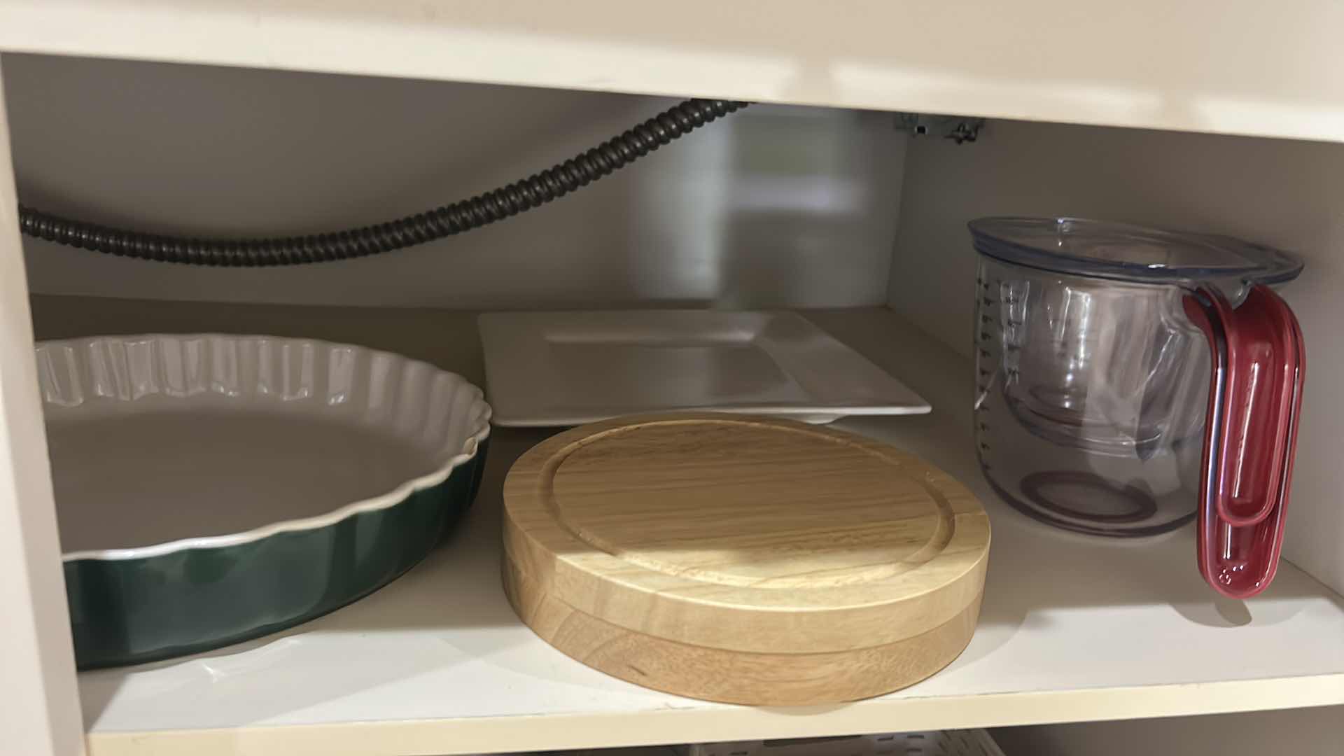 Photo 1 of CONTENTS OF KITCHEN CABINET, MEASURING ITEMS, SERVINGWARE, TEAPOT, AND MORE