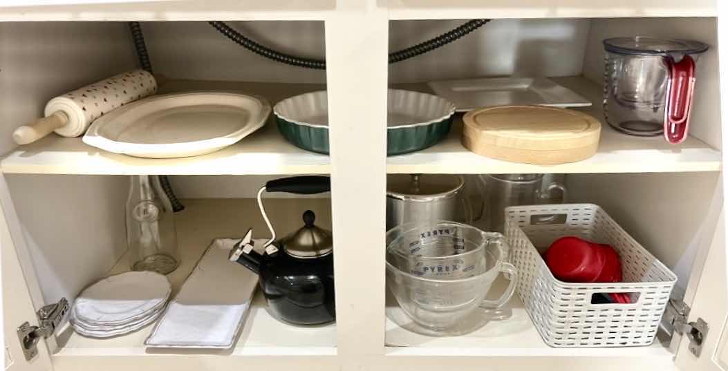 Photo 1 of CONTENTS OF KITCHEN CABINET, MEASURING ITEMS, SERVINGWARE, TEAPOT, AND MORE
