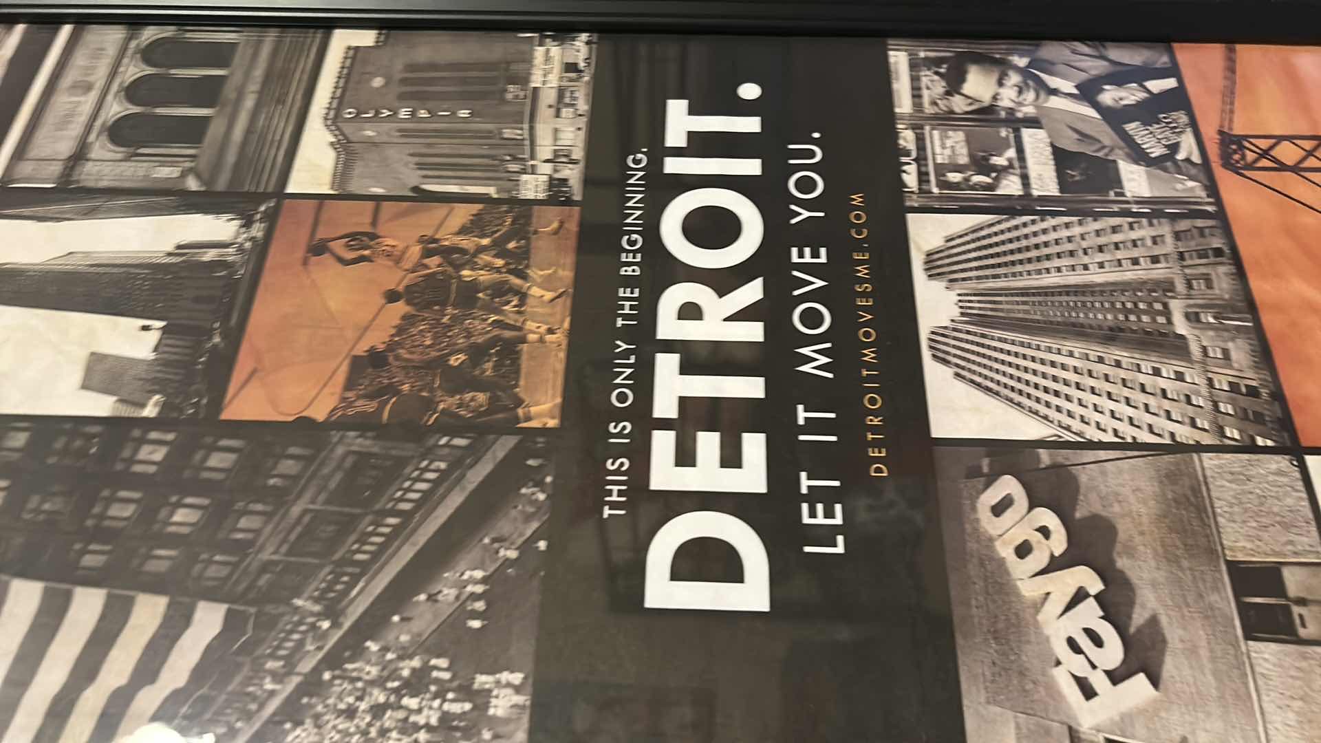 Photo 1 of FRAMED ART PRINT FEATURES A COLLAGE BRANDED WITH THE SLOGAN “DETROIT. LET IT MOVE”. 22 1/4” x H 38 1/4”