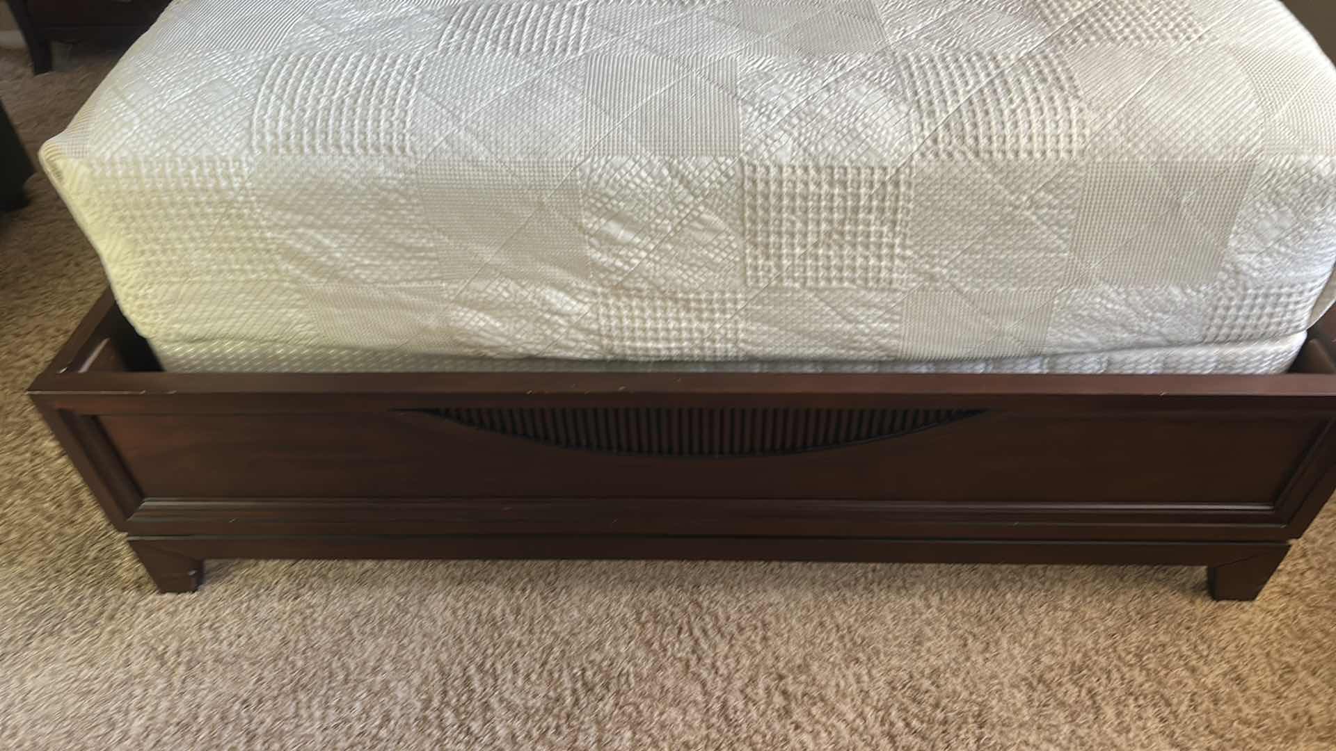 Photo 1 of DARK WOOD PLATFORM BED FEATURING A SLEIGH-STYLE HEADBOARD, MATCHING FOOTBOARD, AND NEUTRAL QUILTED BEDDING WITH ACCENT PILLOWS. INCLUDES SERTA QUEEN MATTRESS. (MATTRESS MEASURES 5 FEET X 81”  INCHES HEADBOARD HEIGHT 52 1/2 INCHES)