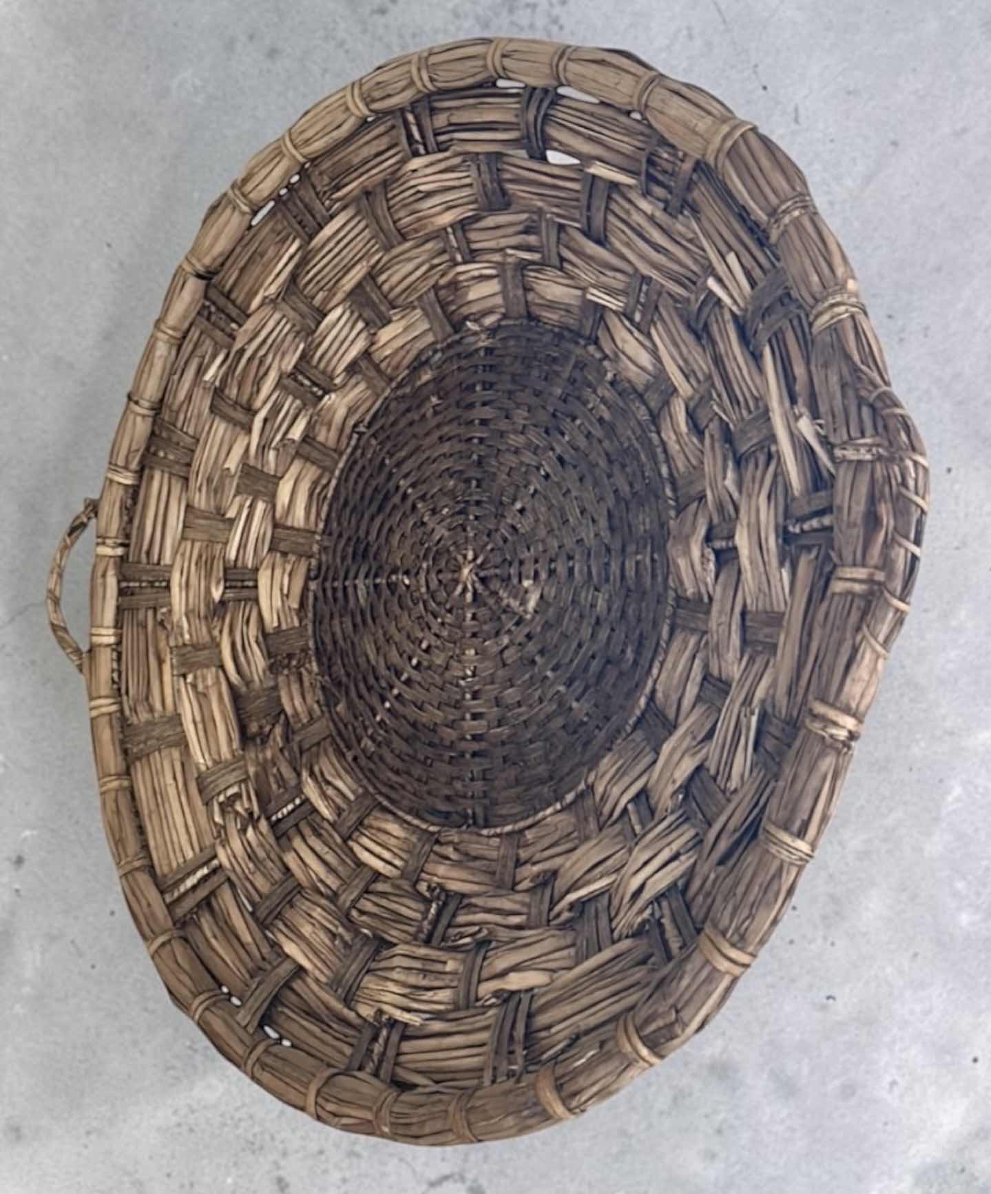 Photo 1 of HAND-WOVEN  WICKER BASKET FEATURES DISTINCTIVE EAR HANDLES AND A DURABLE, RUSTIC CONSTRUCTION. 27” ROUND $80