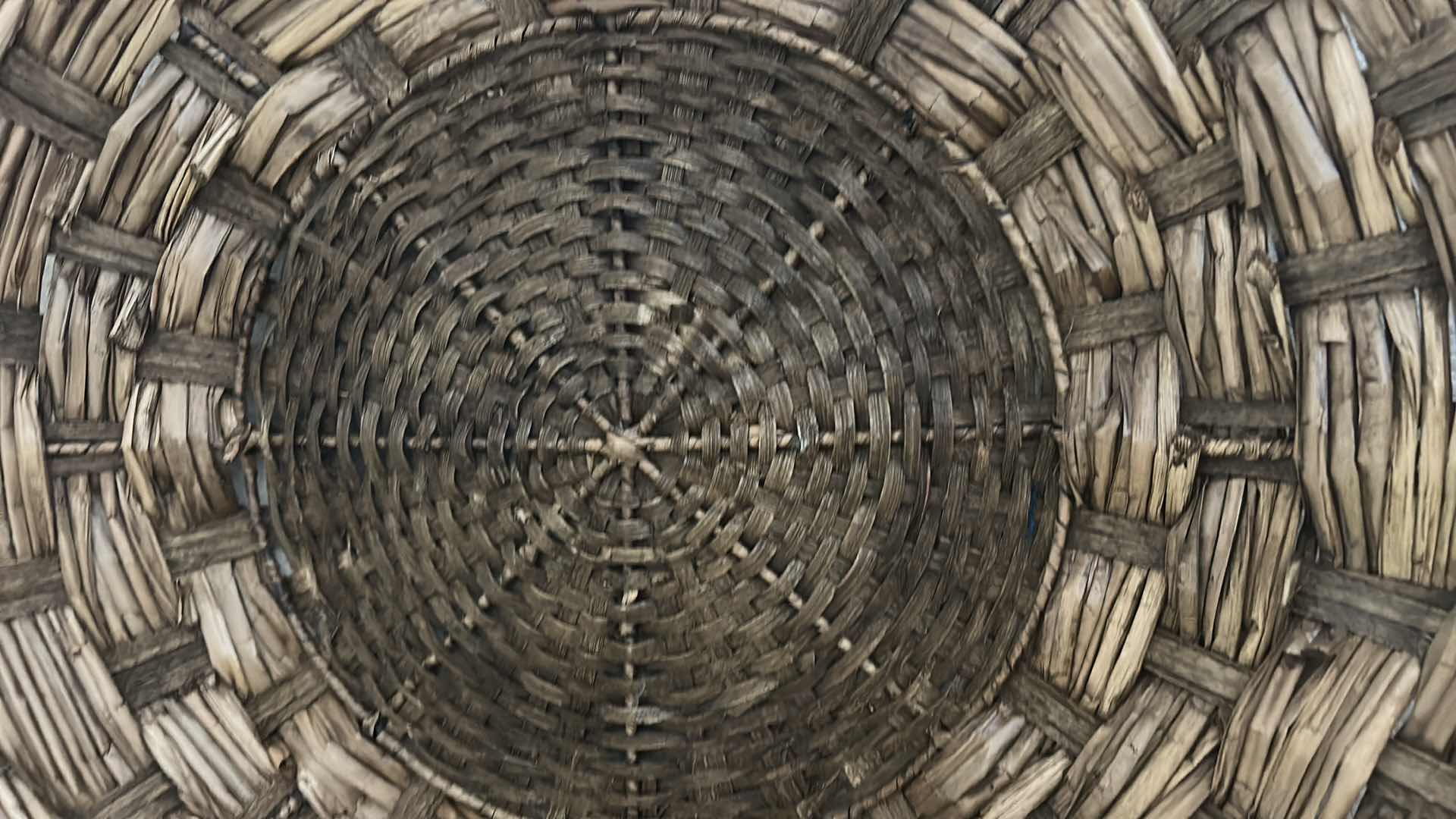 Photo 1 of HAND-WOVEN  WICKER BASKET FEATURES DISTINCTIVE EAR HANDLES AND A DURABLE, RUSTIC CONSTRUCTION. 27” ROUND $80