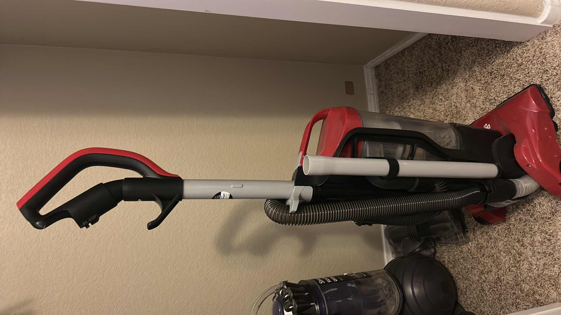 Photo 1 of DIRT DEVIL ENDURA REACH BAGLESS UPRIGHT VACUUM CLEANER IN RED.