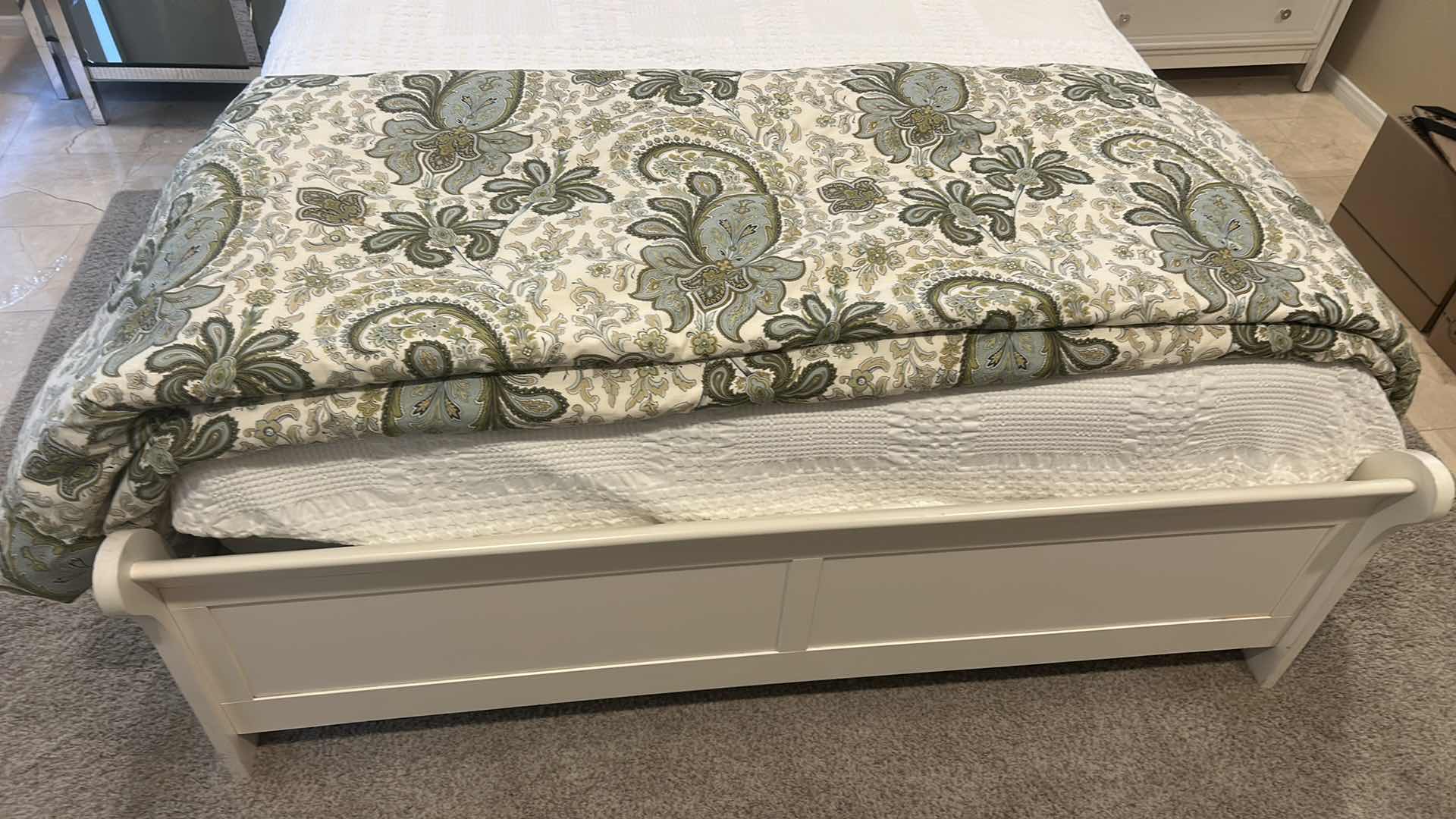 Photo 1 of WHITE SLEIGH BED FRAME FEATURING A CURVED HEADBOARD AND FOOTBOARD, SEALY QUEEN MATTRESS, & BEDDING (HEADBOARD HEIGHT 43”