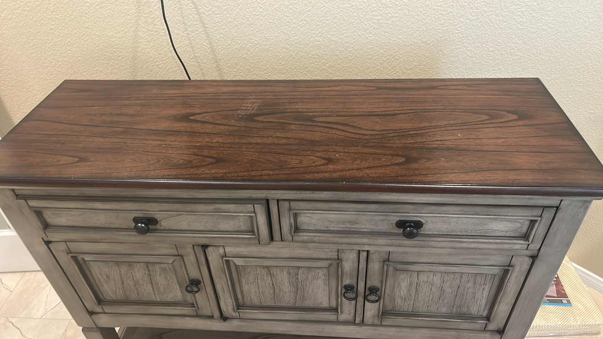 Photo 1 of PIKE & MAIN COLLIN 47” ACCENT CONSOLE FEATURES A DISTRESSED GRAY BASE WITH A DARK WOOD TOP. 47 x 16“ x H36“ $279