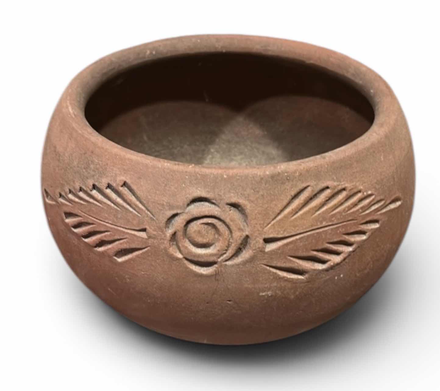 Photo 1 of RUSTICALLY STYLED TERRA COTTA POT FEATURES A HAND-CARVED FLORAL AND LEAF DESIGN. H7.5”