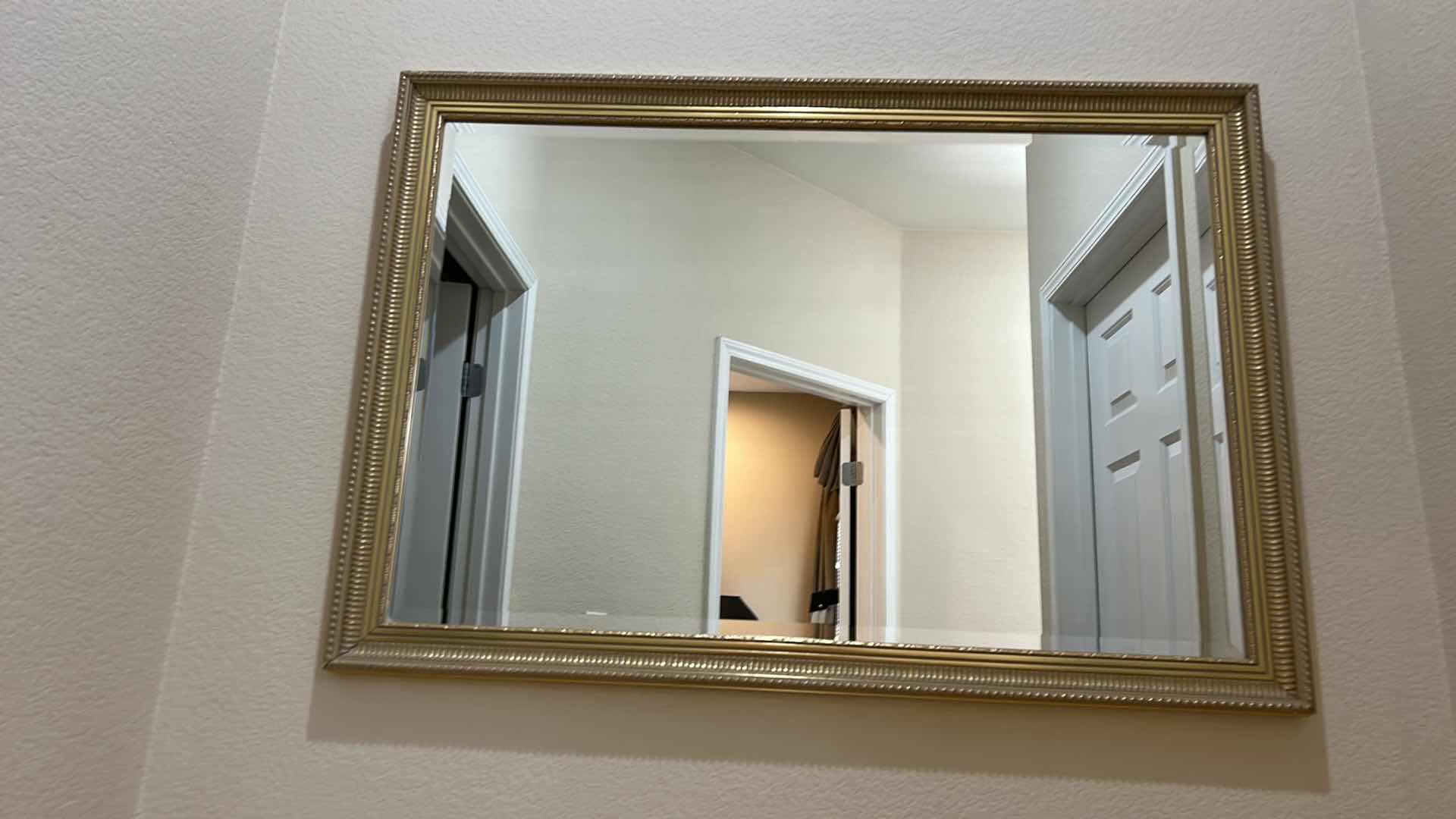 Photo 1 of GOLD FRAMED BEVELED, GLASS MIRROR, 39 1/2” x H27 1/2”