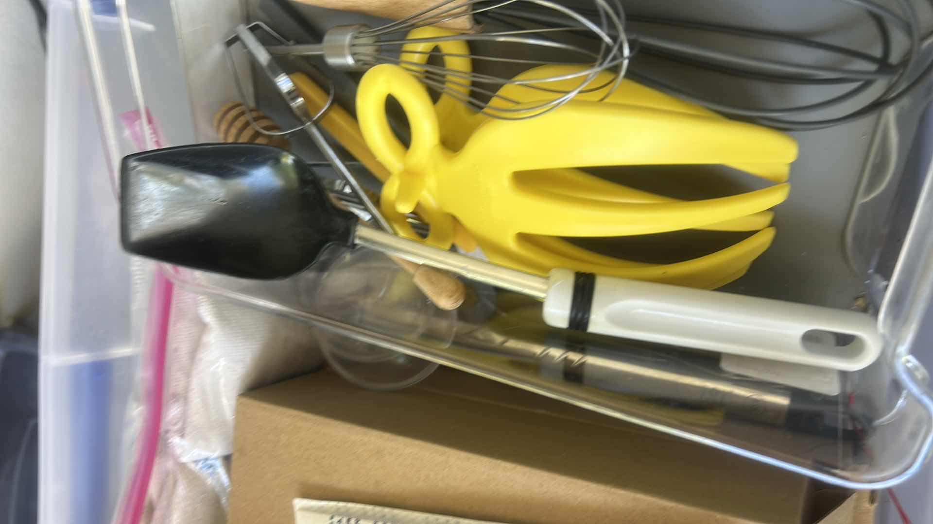 Photo 1 of ASSORTED CRAFT, SEWING, AND HOUSEHOLD SUPPLIES INCLUDING SCISSORS, THREAD, FABRIC, CORDS, CLIPS, AND SMALL TOOLS IN A PLASTIC STORAGE TOTE.