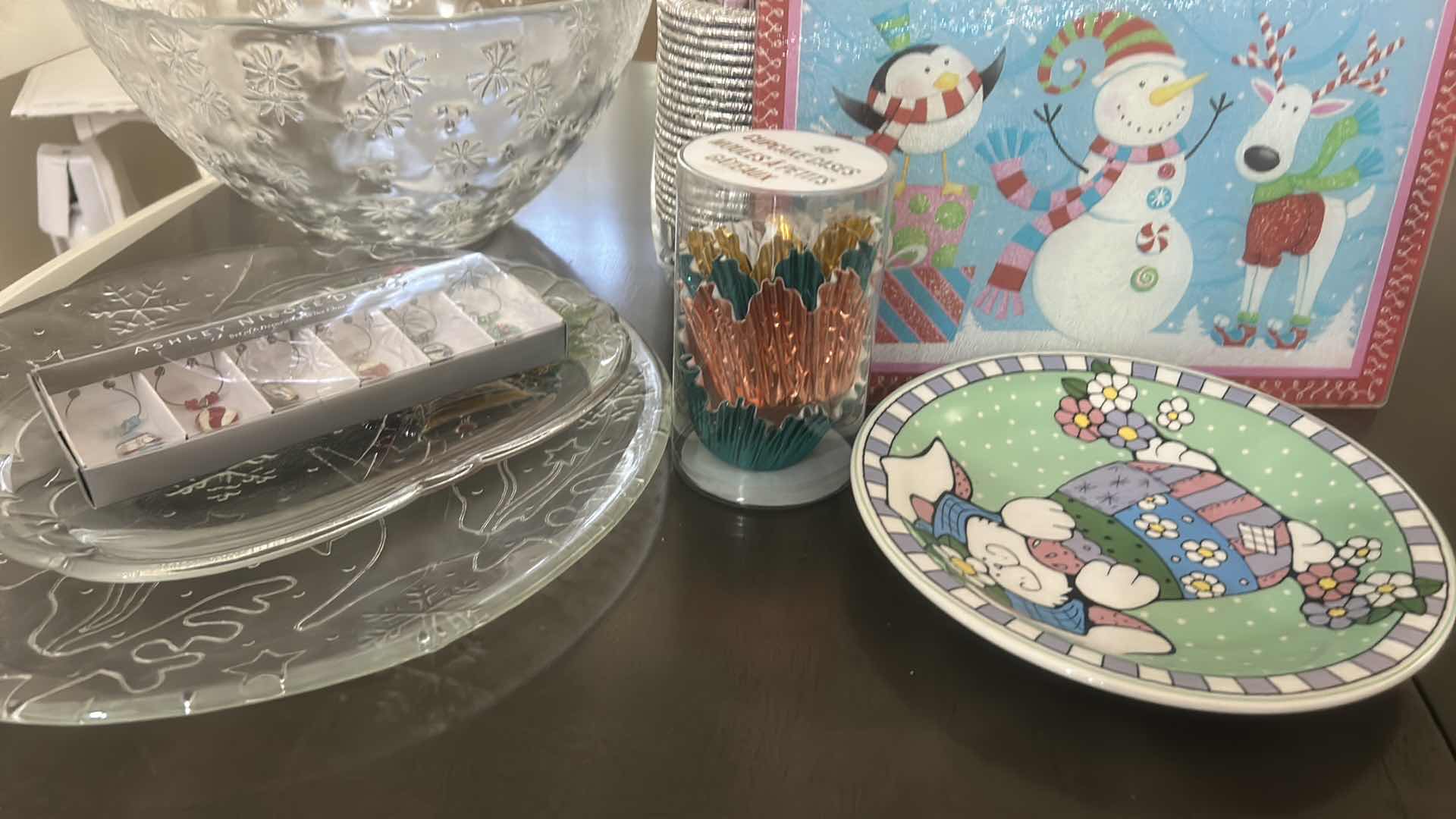 Photo 1 of ASSORTED GLASS SERVING PIECES, HOLIDAY PAPER GOODS, CUPS, NAPKINS, STRAWS, AND DECORATIVE PLATES.