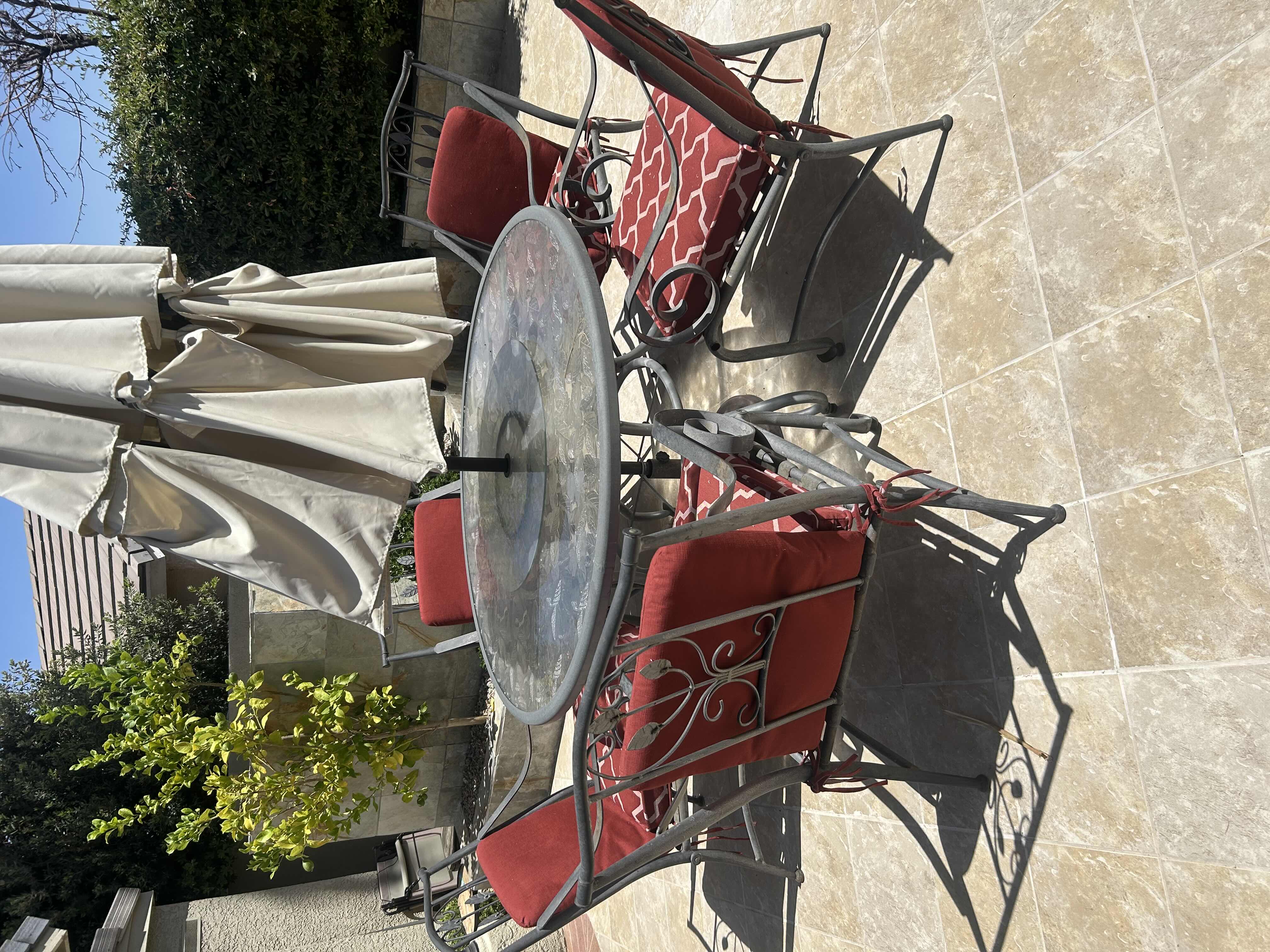Photo 1 of GREY PATIO DINING TABLE W CIRCULAR GLASS TOP ETCHED W LEAF DESIGNS & INTEGRATED LASY SUSAN 60" CHAIRS SOLD SEPARATELY